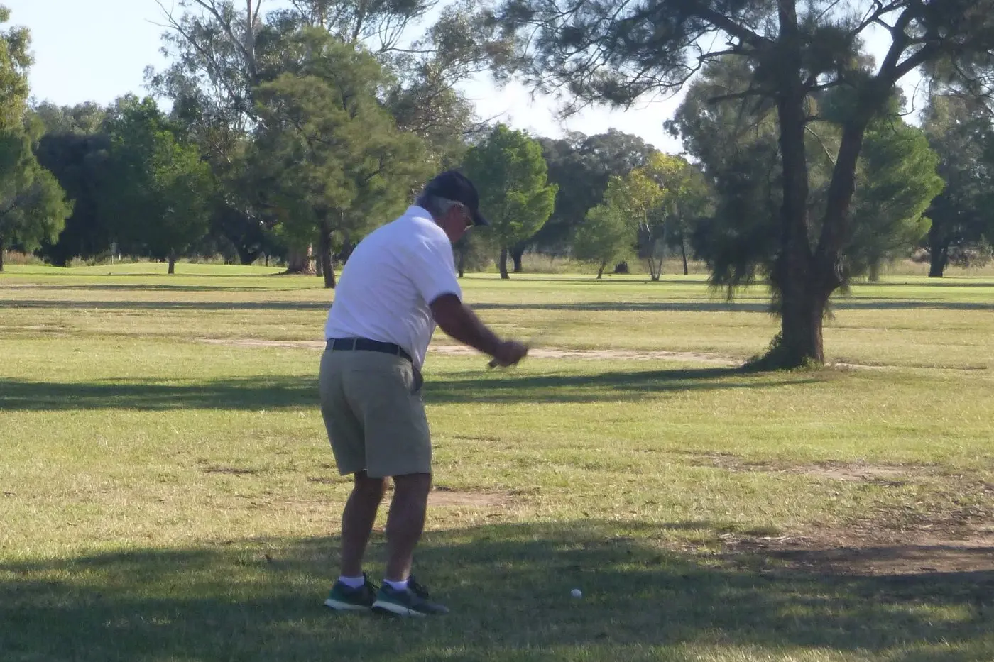 Paul Kay Div-1 winner, enjoying the shade as he plays a shot. PHOTO: Short Putt