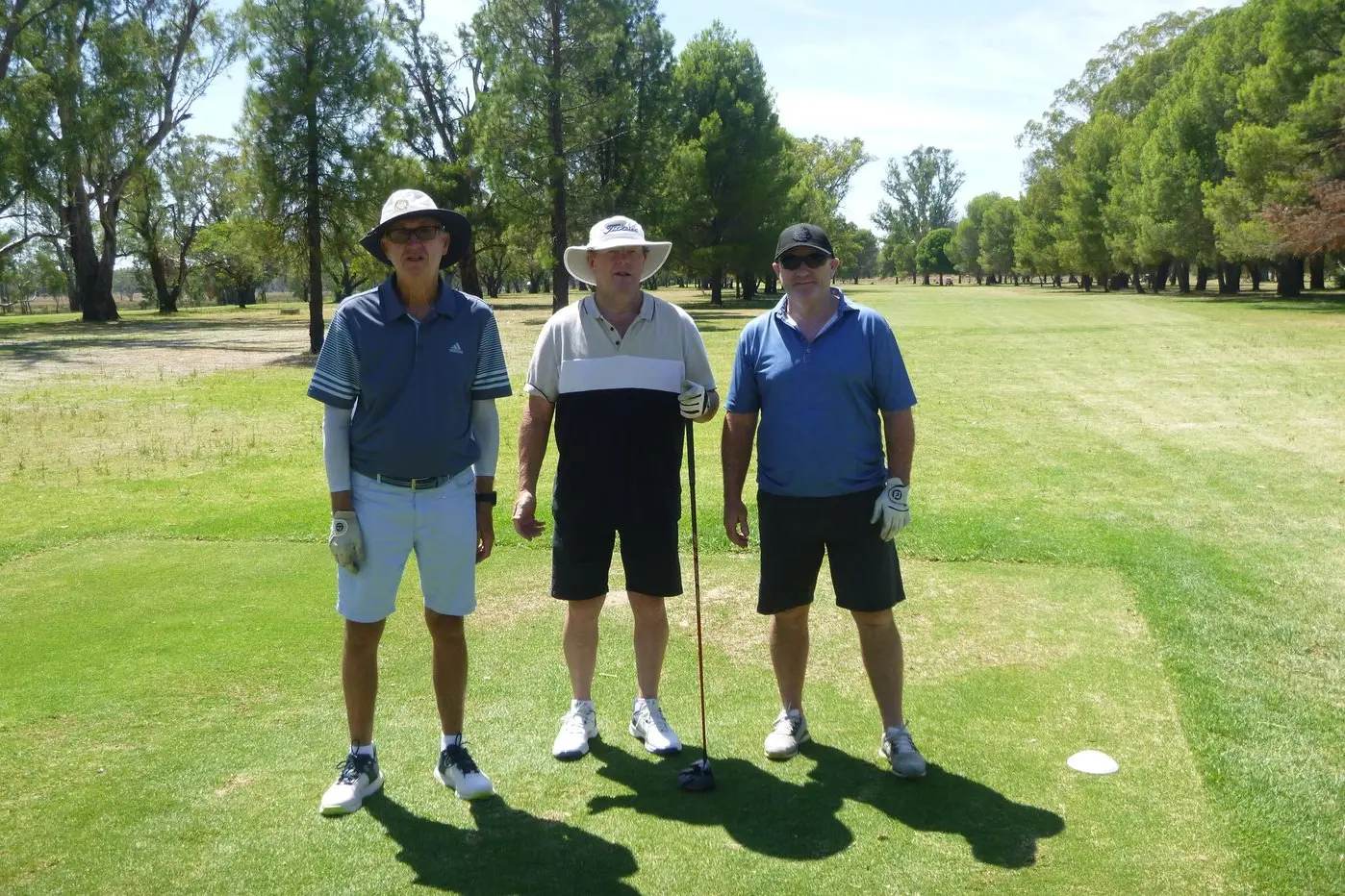 Alf Davies, Laurie O\\u2019Connor and Dave Mylecharane halfway through their round in the sun. PHOTO: Short Putt