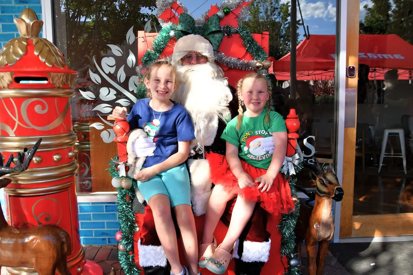 Audrey and Georgia Markwort loved seeing Santa at the Forbes Business Chamber Christmas Carnival. PHOTOS: Jenny Kingham
