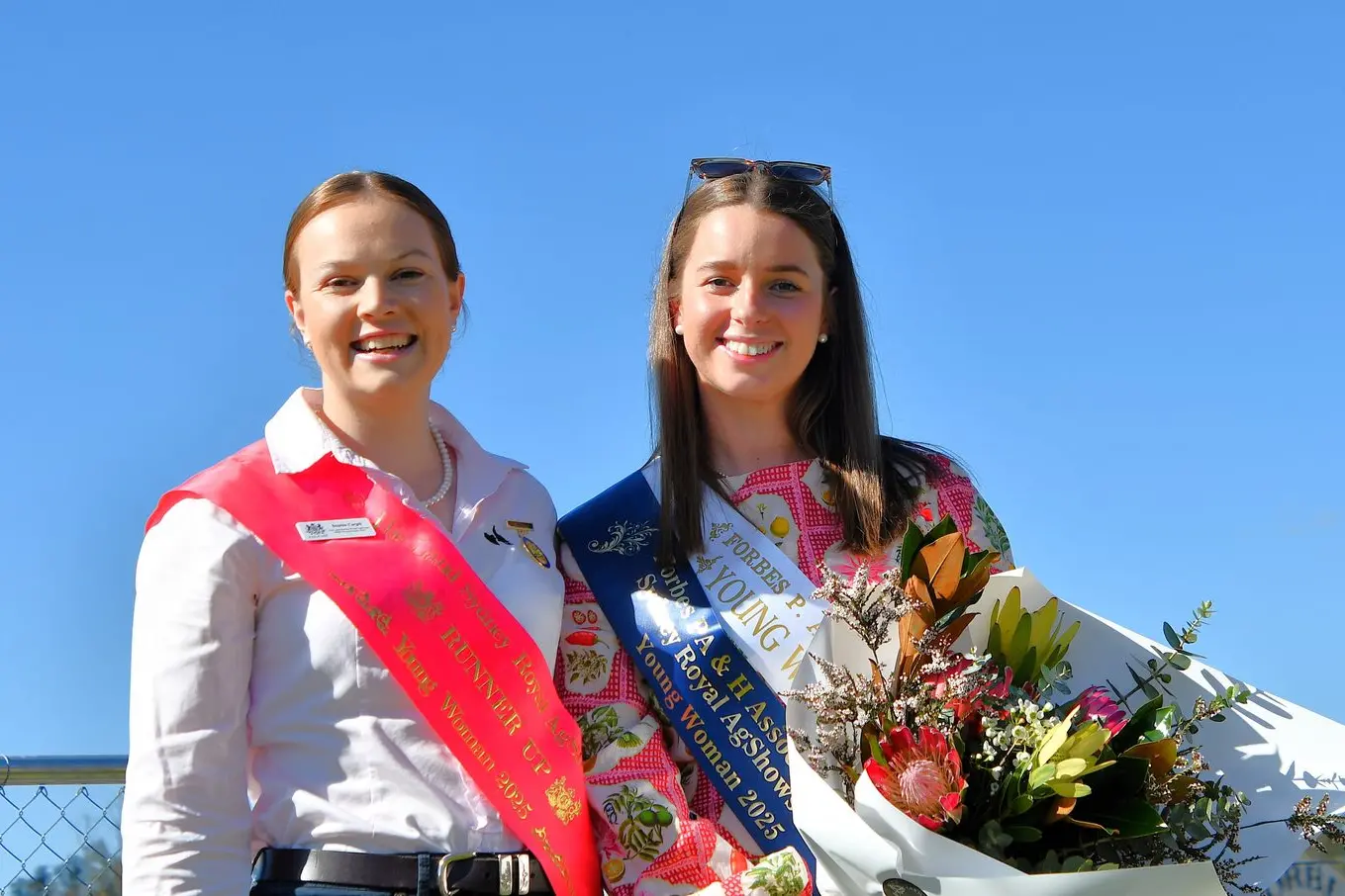 NSW Young Woman runner up Sophie Cargill congratulates Forbes Show Young Woman Libby Coles.