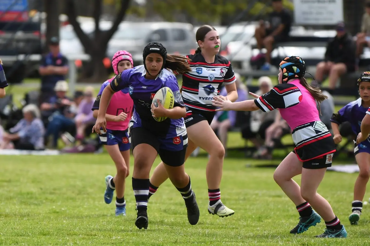Kitarna Atkinson gaining ground for Lachlan Under 12s in their home ground win against Goannas.