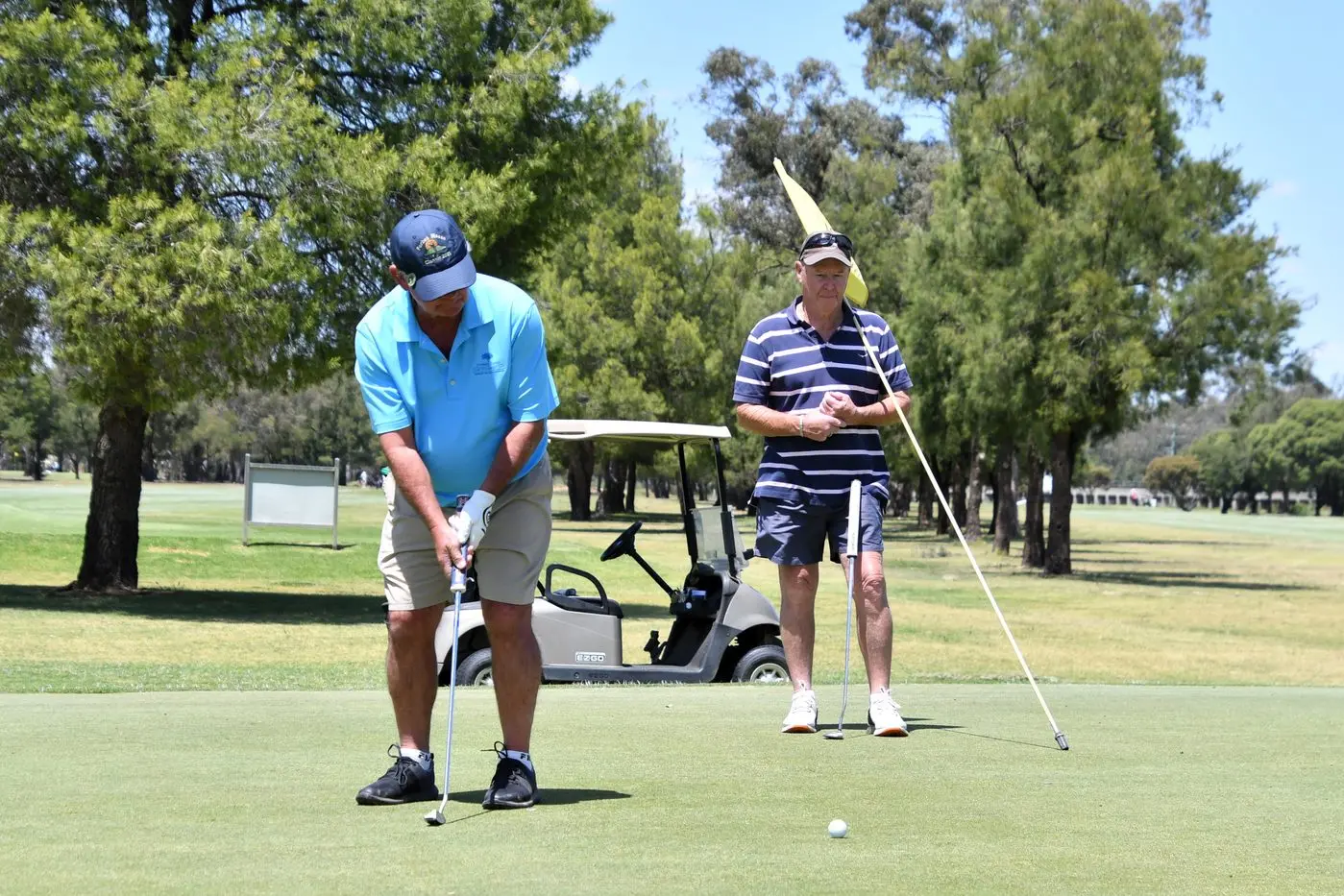 Paul Kay putts, watched by Scott Kirkman. PHOTO: Jenny Kingham