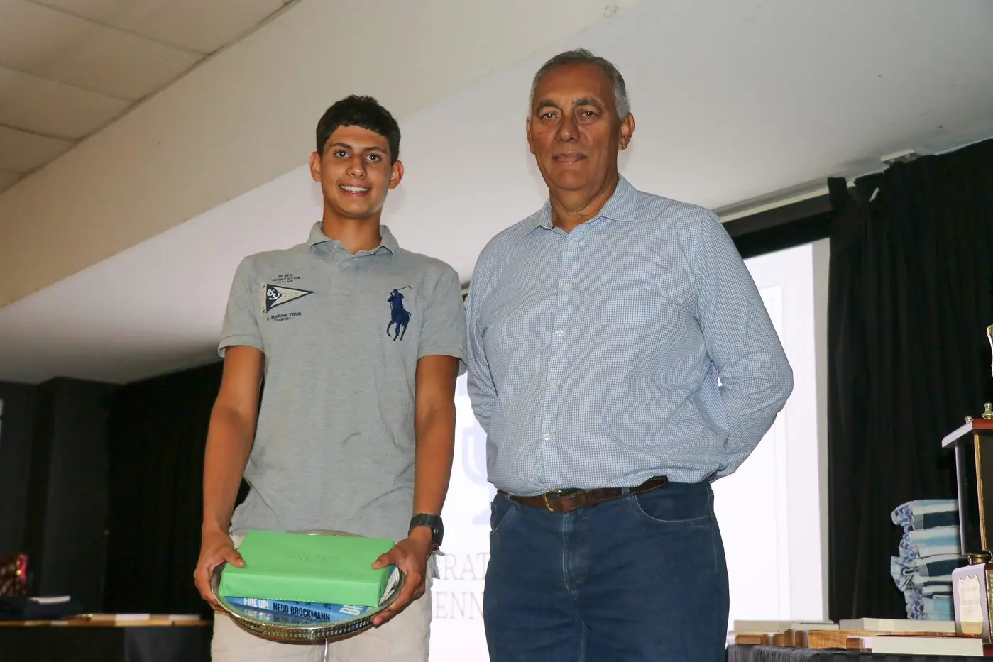 Lenny Iyer receives the Phillip Adams Encouragement Award from Cr Steve Karaitiana. 