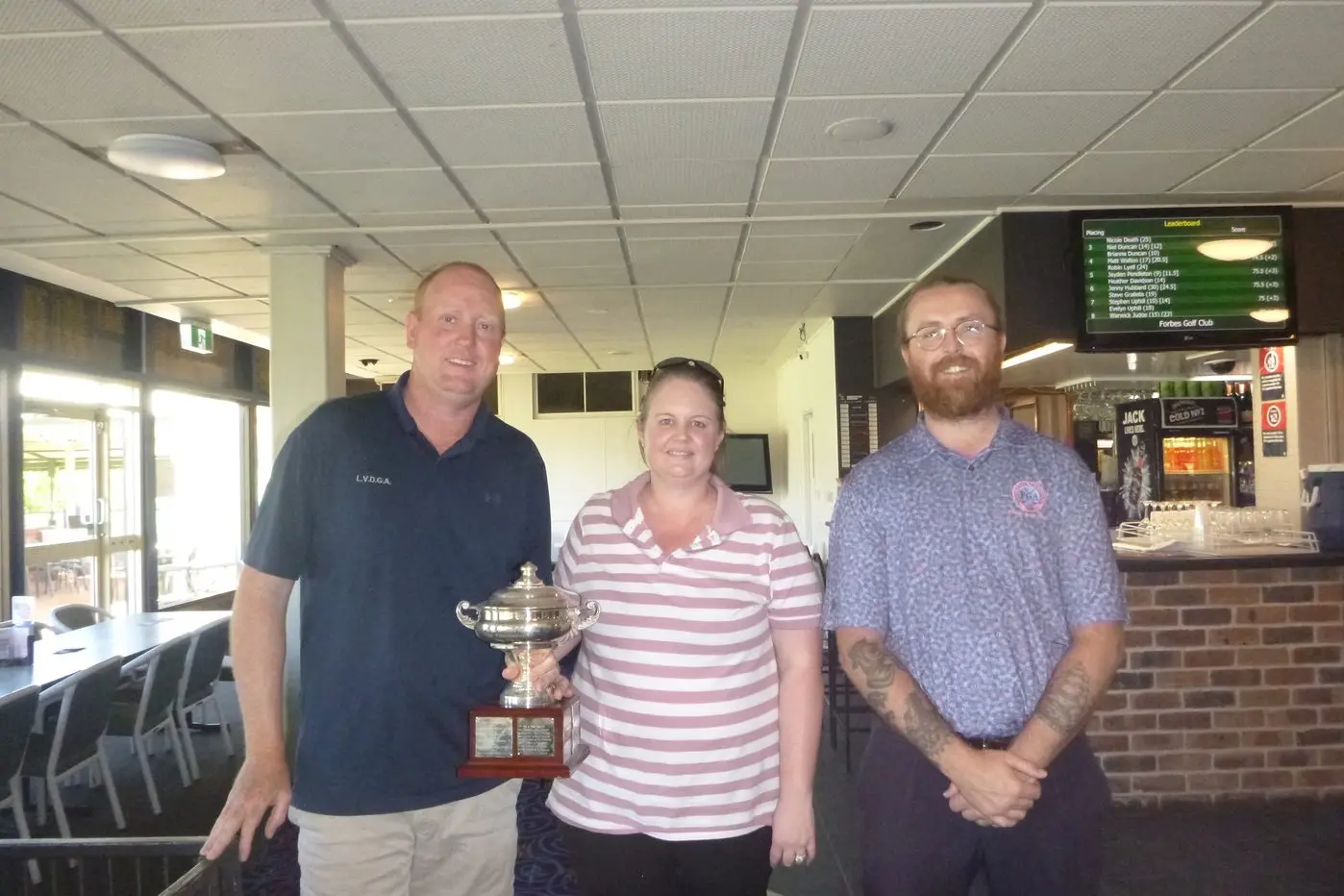Winners of the Mixed Foursomes Scratch Championships \\u2013 John Betland and Nicole Death with Head Pro Will. PHOTO: Short Putt