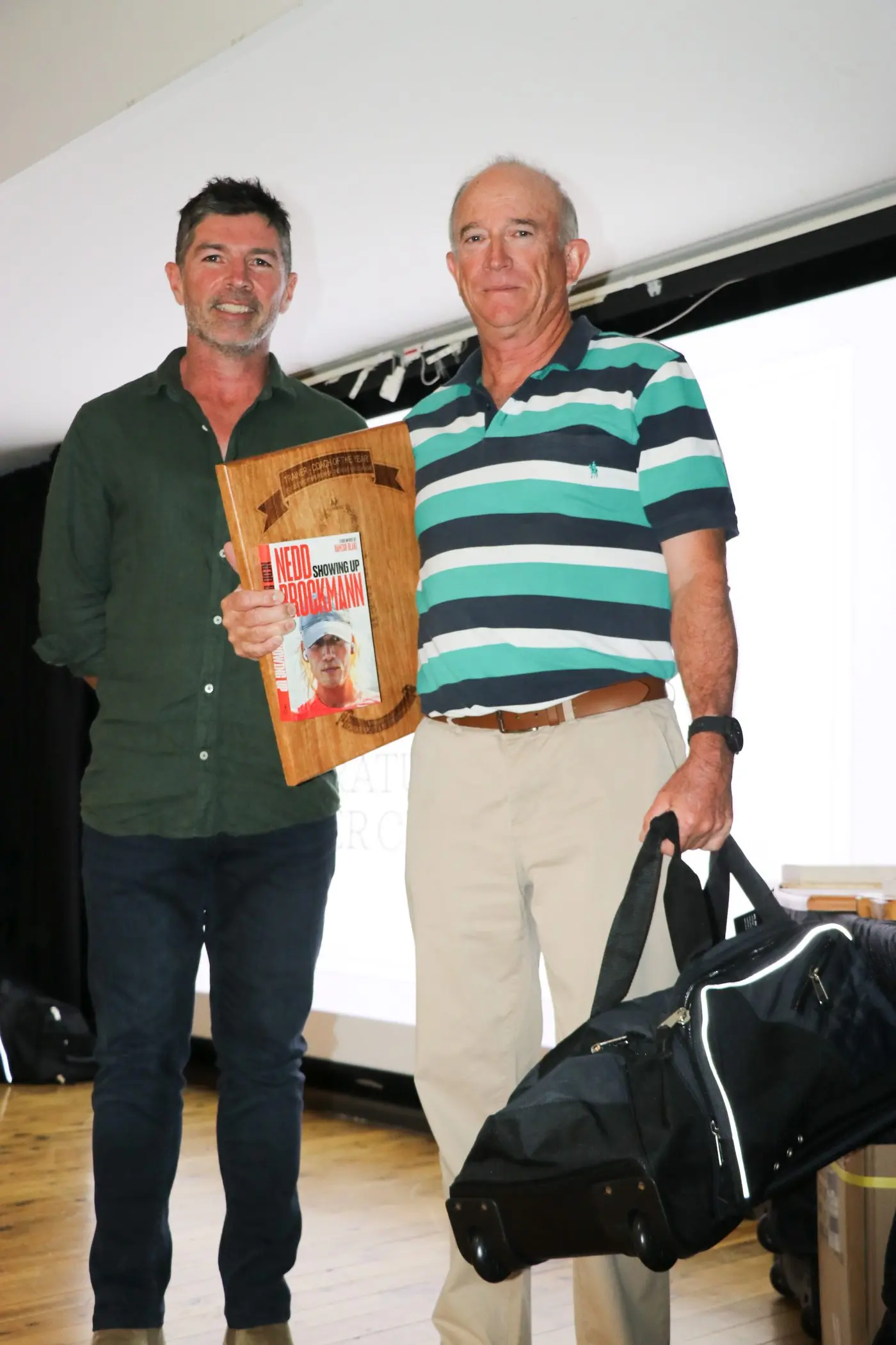 Nick Field congratulates our Coach / Trainer of the Year Peter Clifton, tennis.