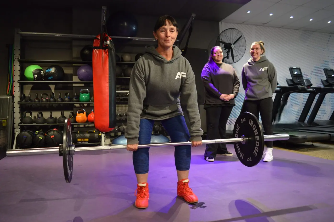 Sherrie Williams, who\\'s living in Tullamore and works at Anytime Fitness in Forbes, will attempt to break a one-arm deadlift Guinness World Record this month, and behind her every step of the way are her colleagues D-Arne Gunn and club manager Zara Crawford. PHOTO: Christine Little