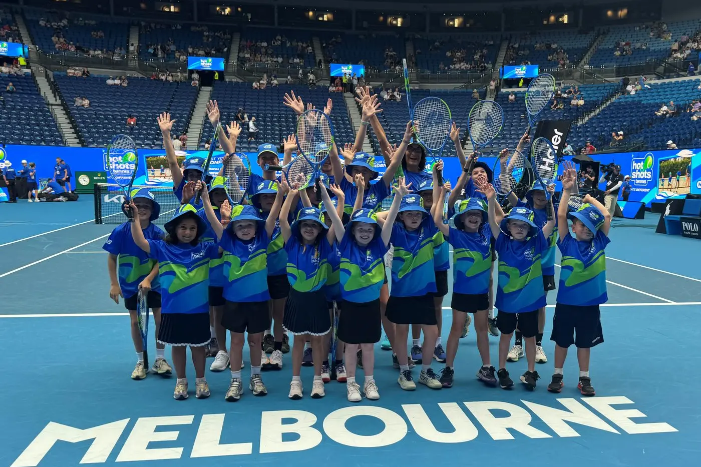 Helen Magill took 20 kids to the 2025 Australian Open. They are pictured on Rod Laver Arena. PHOTOS: Supplied.