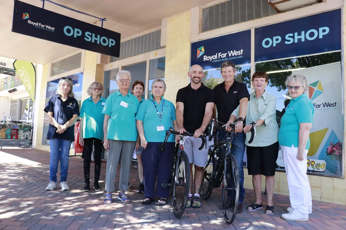 Luke Randall and Stuart Thomas are preparing for the ride to Sydney, cheered on by delighted Royal Far West Forbes volunteers Sally Bowen, Julie James, Pat McGrath, Molly Neilsen, Rona Pritchard, Ngarie Bilsborough and Maureen Bale.