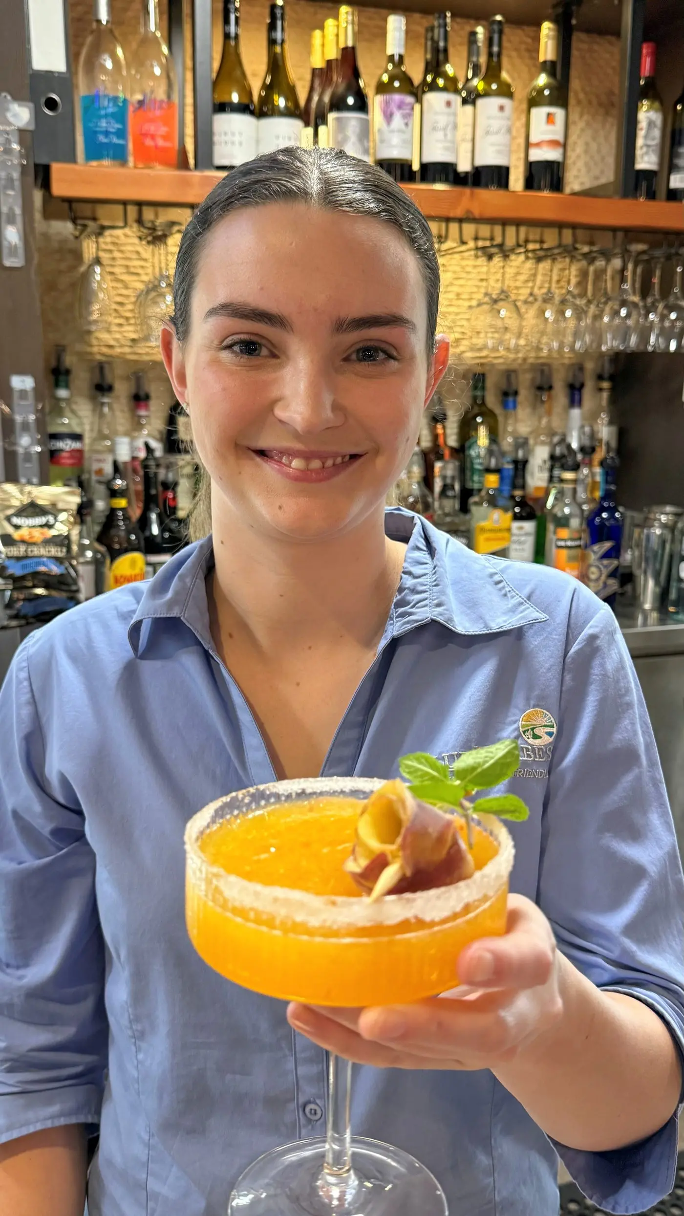 Abbey Hodges-Lockwood and her Velvet Sunrise cocktail inspired by and featuring beautiful local peaches. 