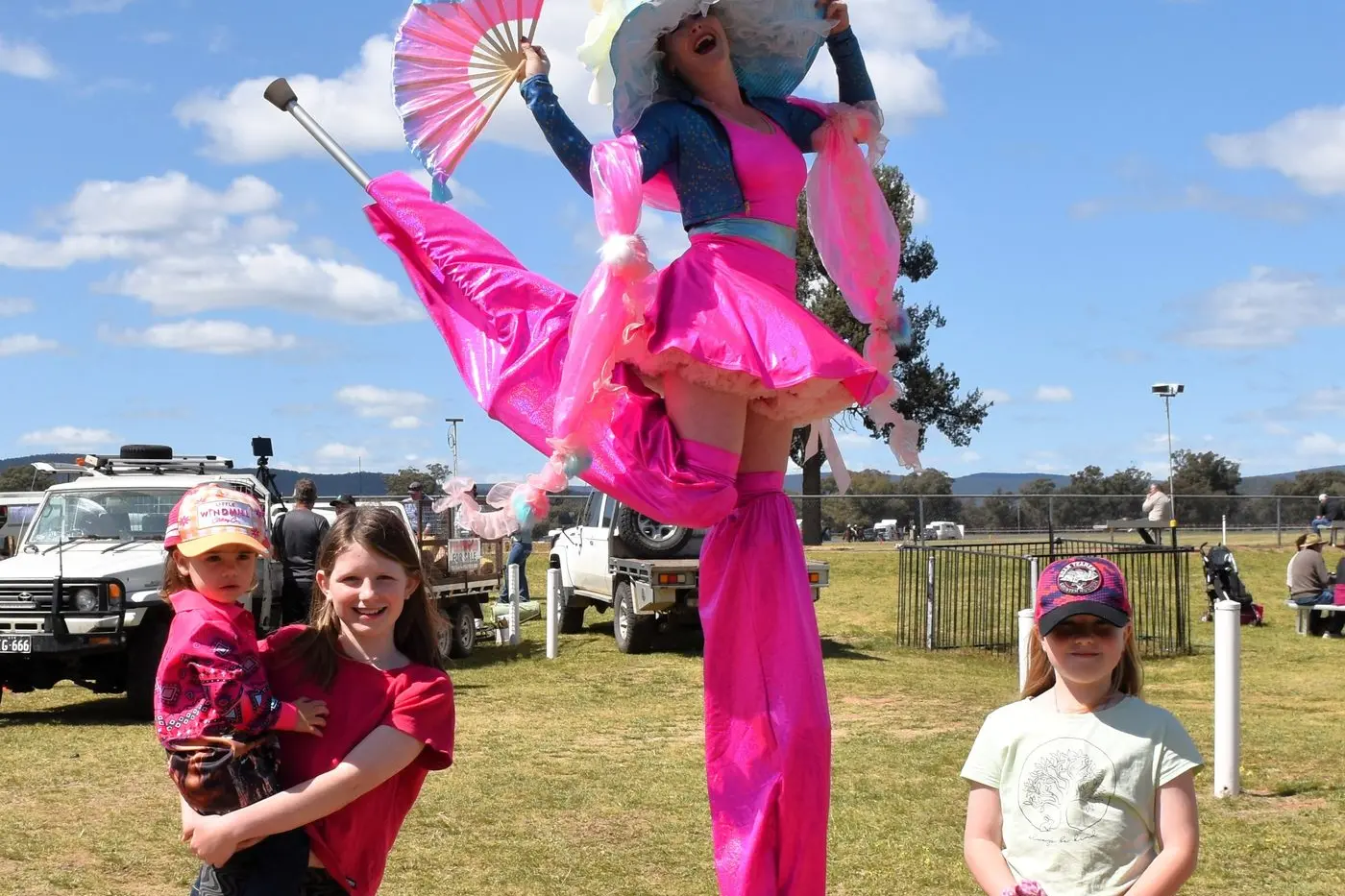 Returning after 2024 Show success ... Kat in the Hat does a high kick on the stilts with Sienna Gibson holding Charlotte and Mia Fazzari.