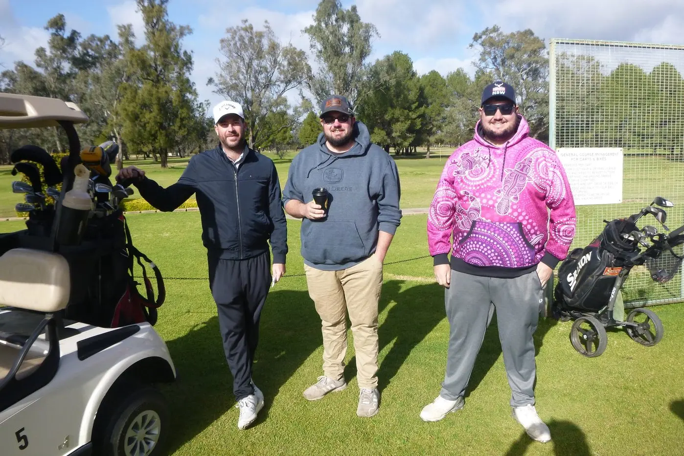 Ready for golf : Marcus Inder, Nick Inder and Kailab Tyne are prepared for their game as they await their fourth member.