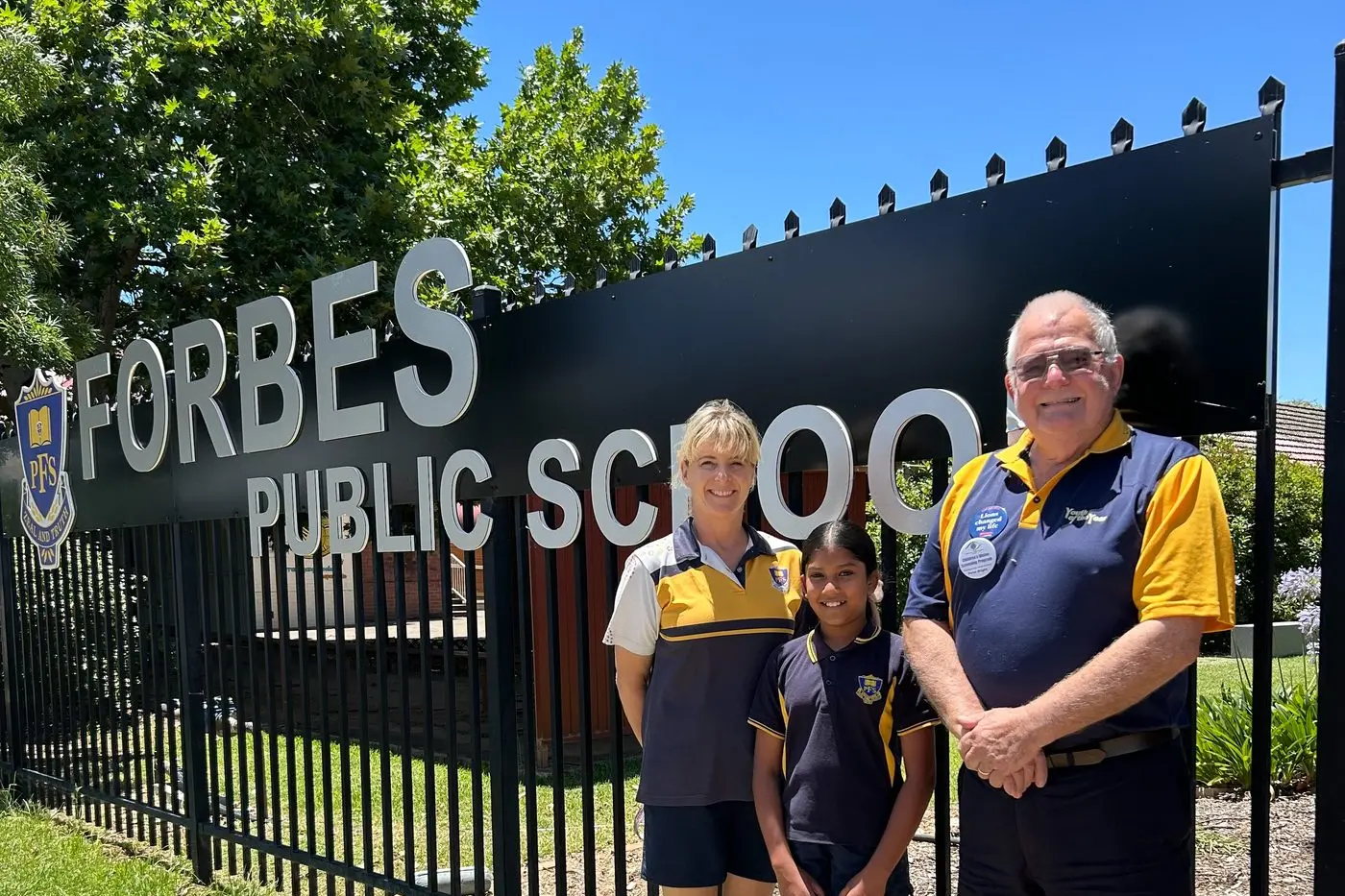 Githmi Gamage congratulated by Katie Stitt, Forbes Public School, and Peter Bright, Forbes Lions.