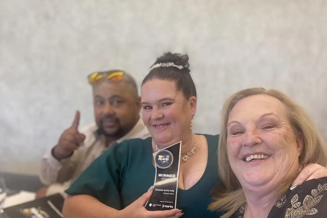 Bogan Gate Pub managers Chris and Kerrie-Anne Schembri, and chef Denise Dwyer proudly show-off their award on Tuesday. Photo by Bogan Gate Pub