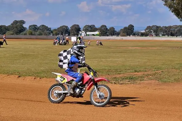Lochie Duggan lapping with the winner\\'s flag. Photo by Nic Pic NSW