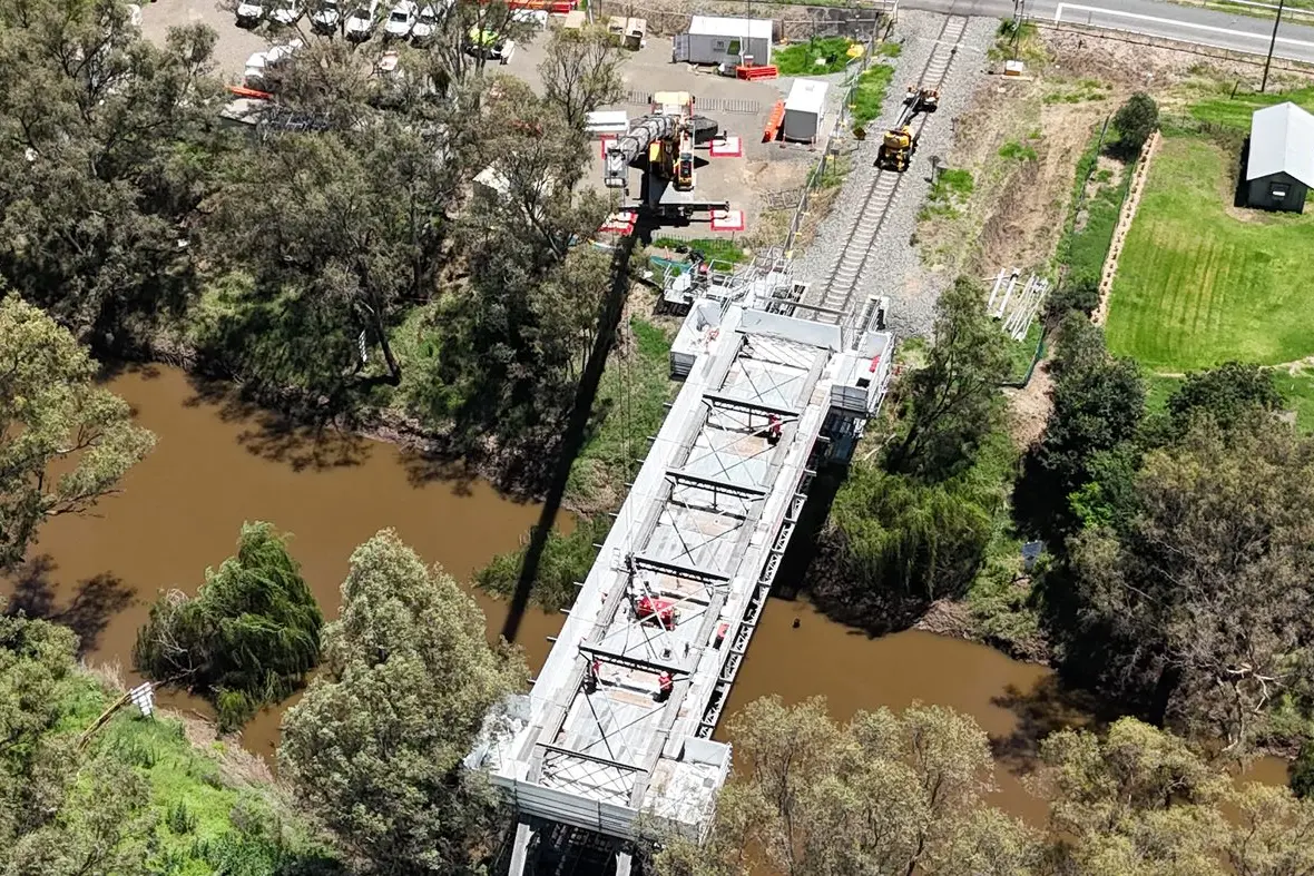 Wrapped in scaffolding and sheeting, the Lachlan River Bridge now supports a safe working platform for Inland Rail workers to carry out modifications to the bridge\\'s bracing structure to provide clearance for double-stacked freight trains. PHOTOS: Supplied
