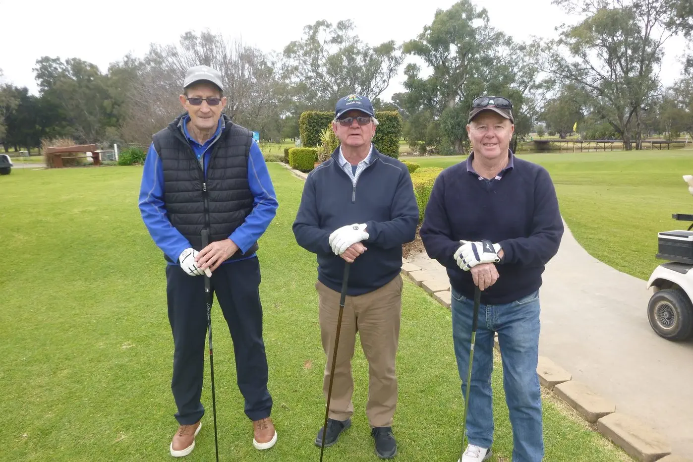 All dressed for warmth, as Al Rees, Paul Kay and Scott Kirkman get set for their game.\\'.