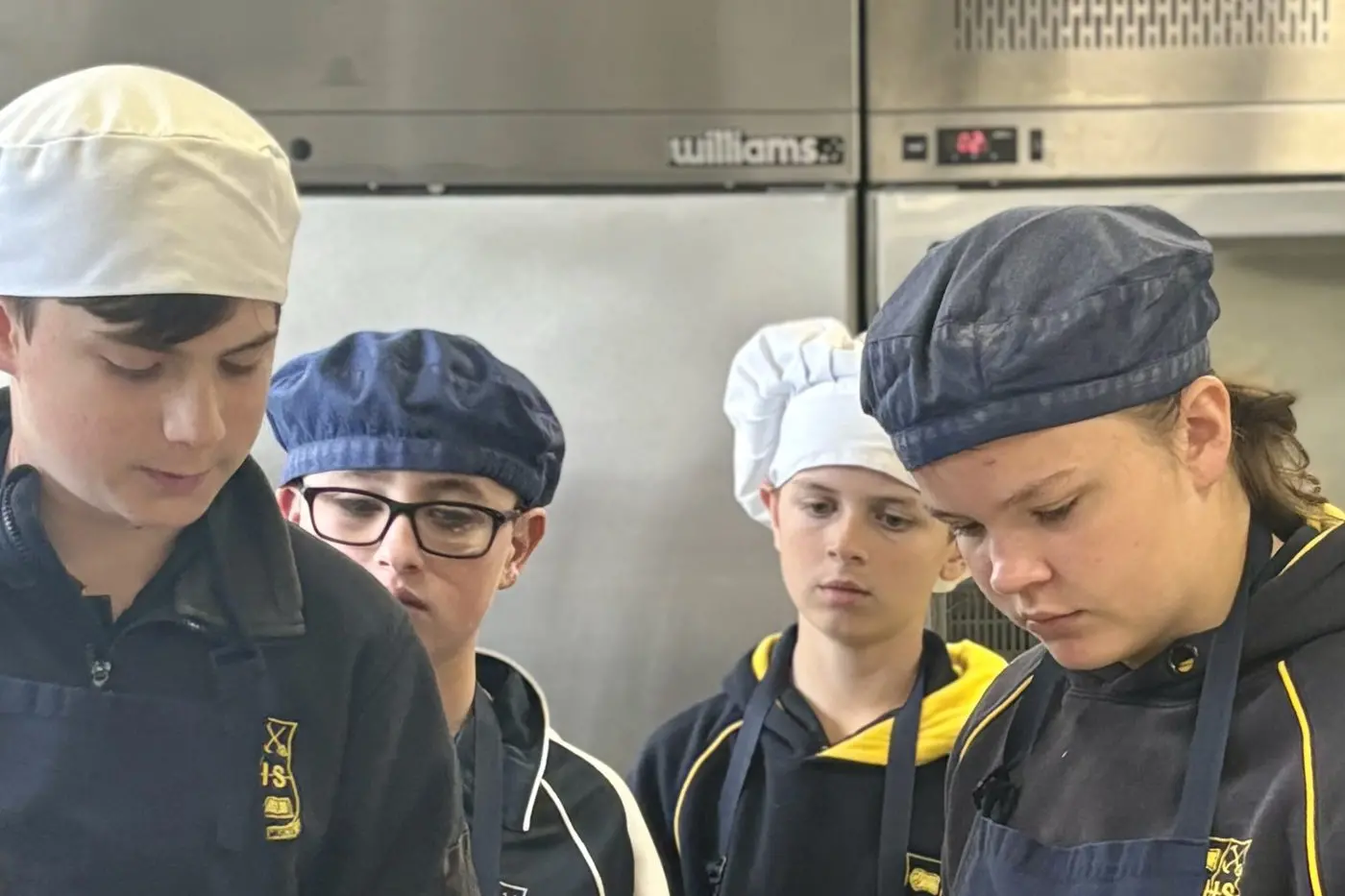 Drake, Adam, Wade and Aurora cooking up a storm. 