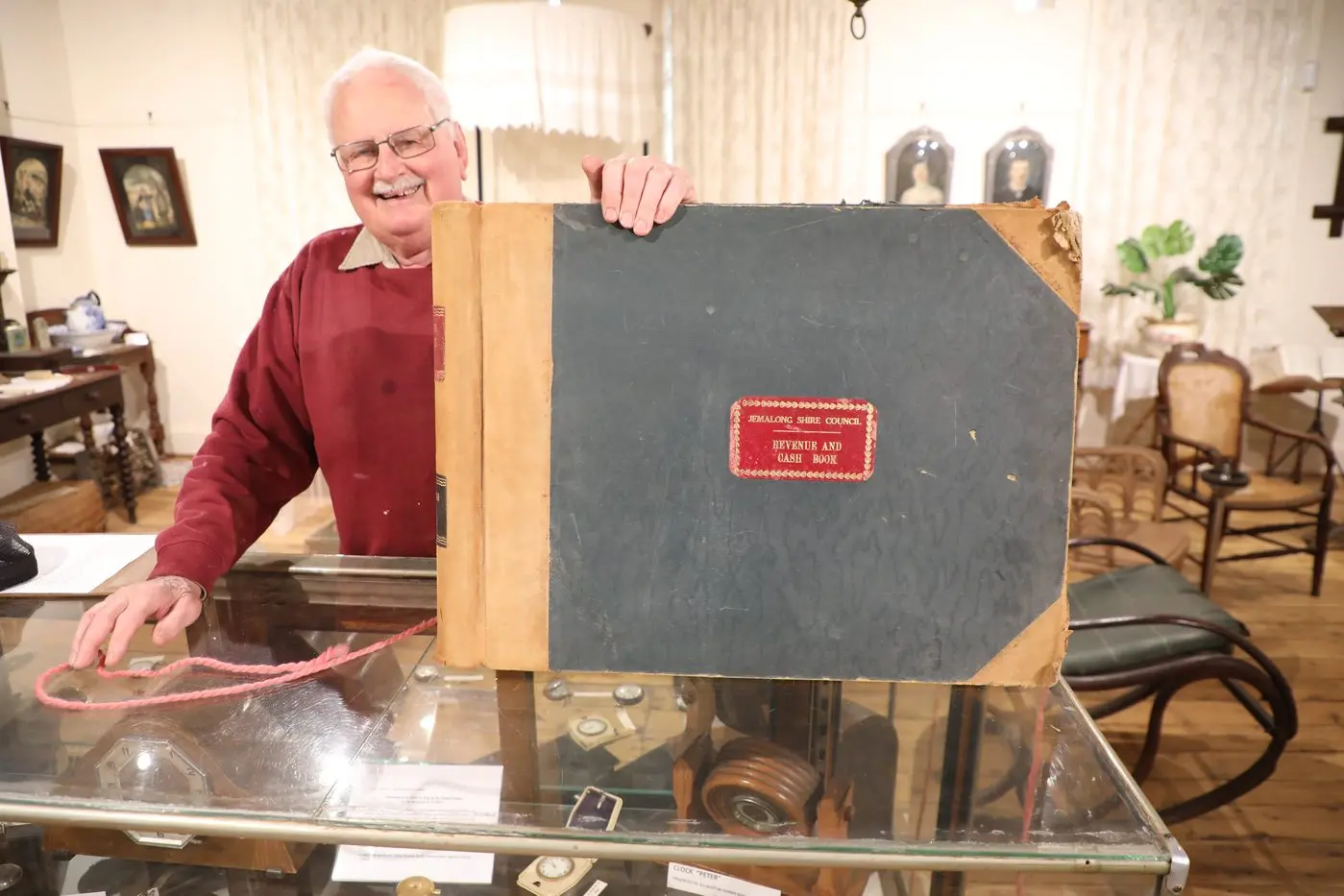Forbes and District Historical Society (FDHS) President Bruce Adams with one of the council record books to be kept at the museum. PHOTO: Supplied