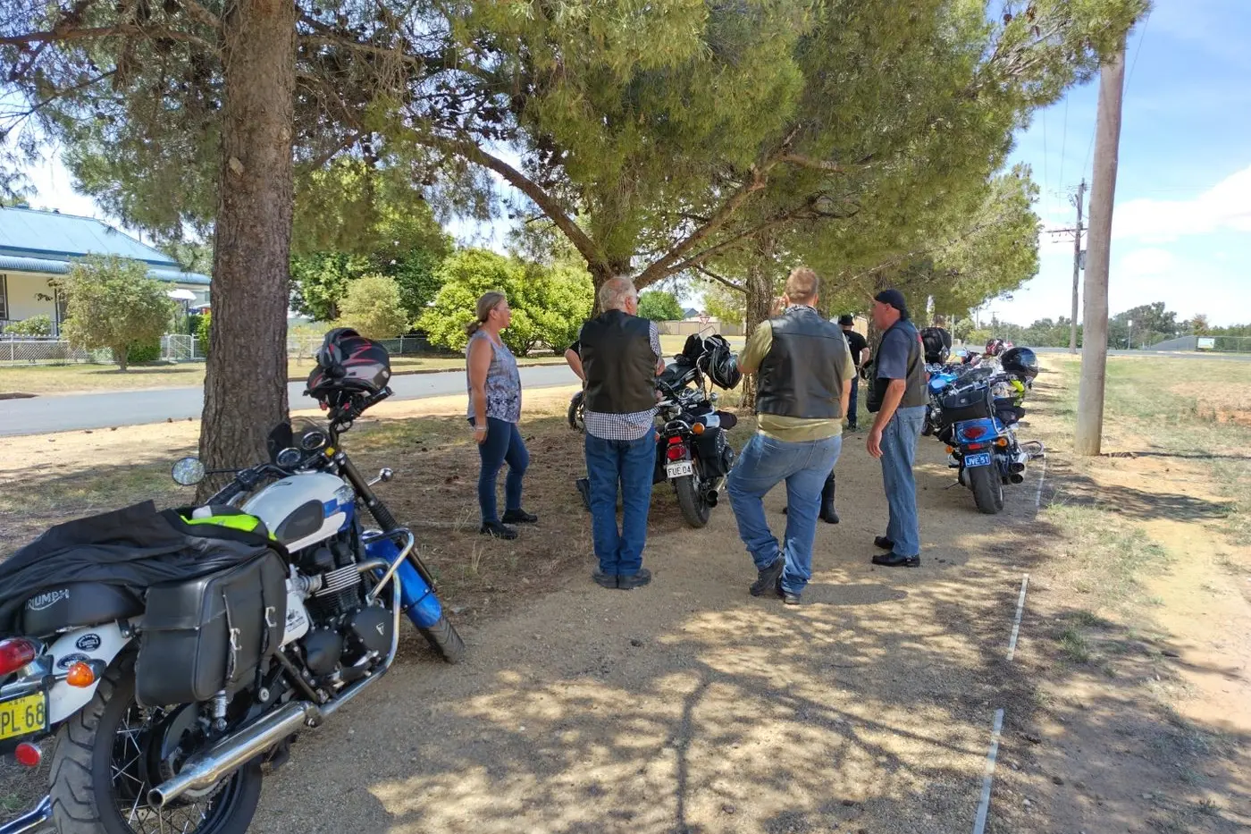 BRAVING the weather, the social rides taking a short rest en route to Gooly. PHOTOS: Supplied