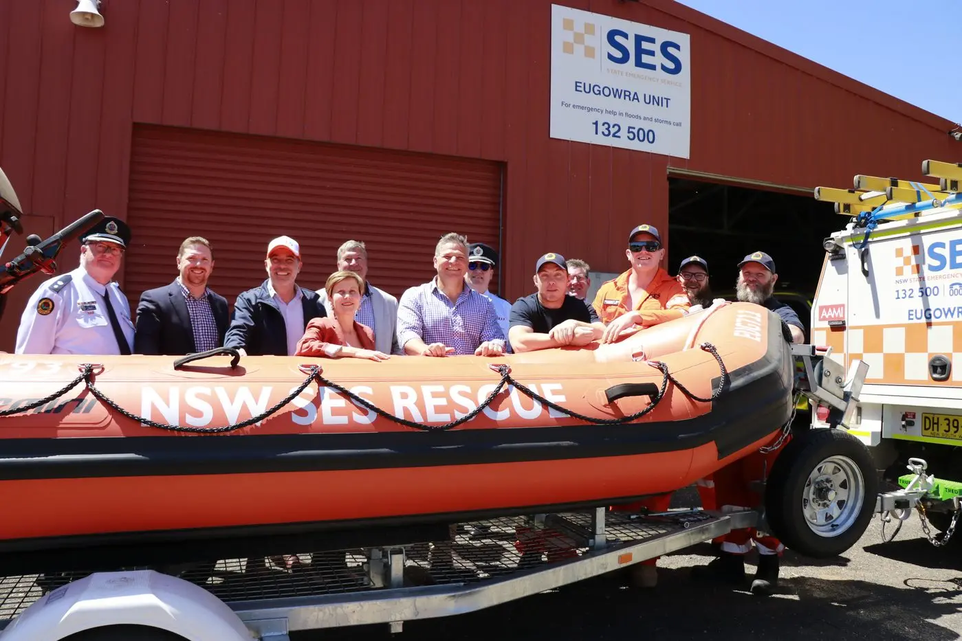NSW Emergency Services Minister Jihad Dib, Senator Jenny McAllister, Central West Deputy Zone Commander Craig Ronan, NSW SES Assistant Commissioner Colin Malone, MP Philip Donato present the new rescue boat to Eugowra Unit Commander Anthony Robinson and Eugowra SES volunteers.