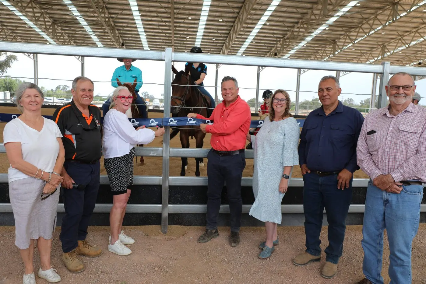 Cr Marg Duggan, Deputy Mayor Chris Roylance, Mayor Phyllis Miller, MP Phil Donato, Cr Steve Karatiana and Cr Brian Mattiske with riders at the opening of the Multipurpose Equestrian Centre. PHOTO: Forbes Shire Council