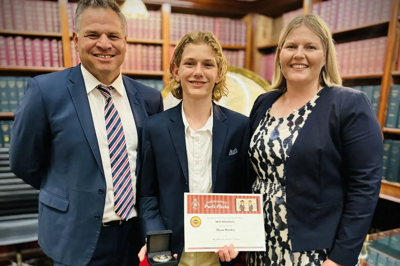 Oscar Hendry (13) from Red Bend Catholic College with mum Kelly and Member for Orange Phil Donato at the 2024 Parli-Flicks Short Film Award presentation.