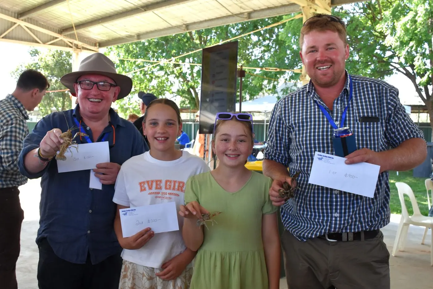 Winners are grinners with their winning yabbies - Peter Gasson (3rd), Zola King and Pippa Grayson (2nd) and Jack Rix (1st).