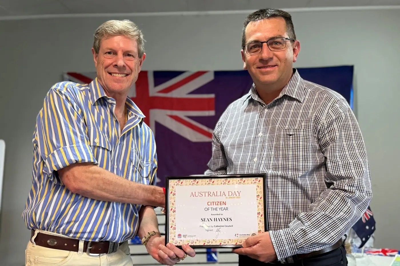 Cabonne Australia Day Ambassador Warren Potent congratulates Eugowra Citizen of the Year Sean Haynes. 