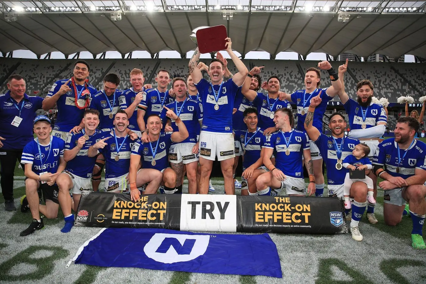 Billy Burns holds the trophy high after Newtown Jets win the NSW Knock On Cup. PHOTO: Supplied