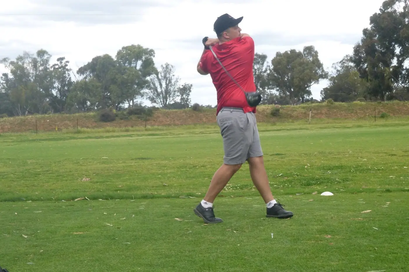 Ollie Patterson lets it all go for his tee shot on the 12th. PHOTO: Short Putt