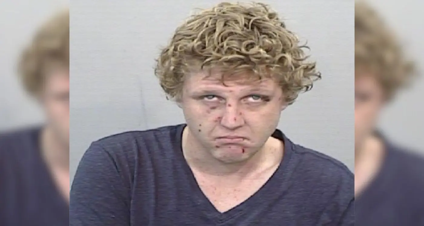 Man on outstanding warrant wanted by police