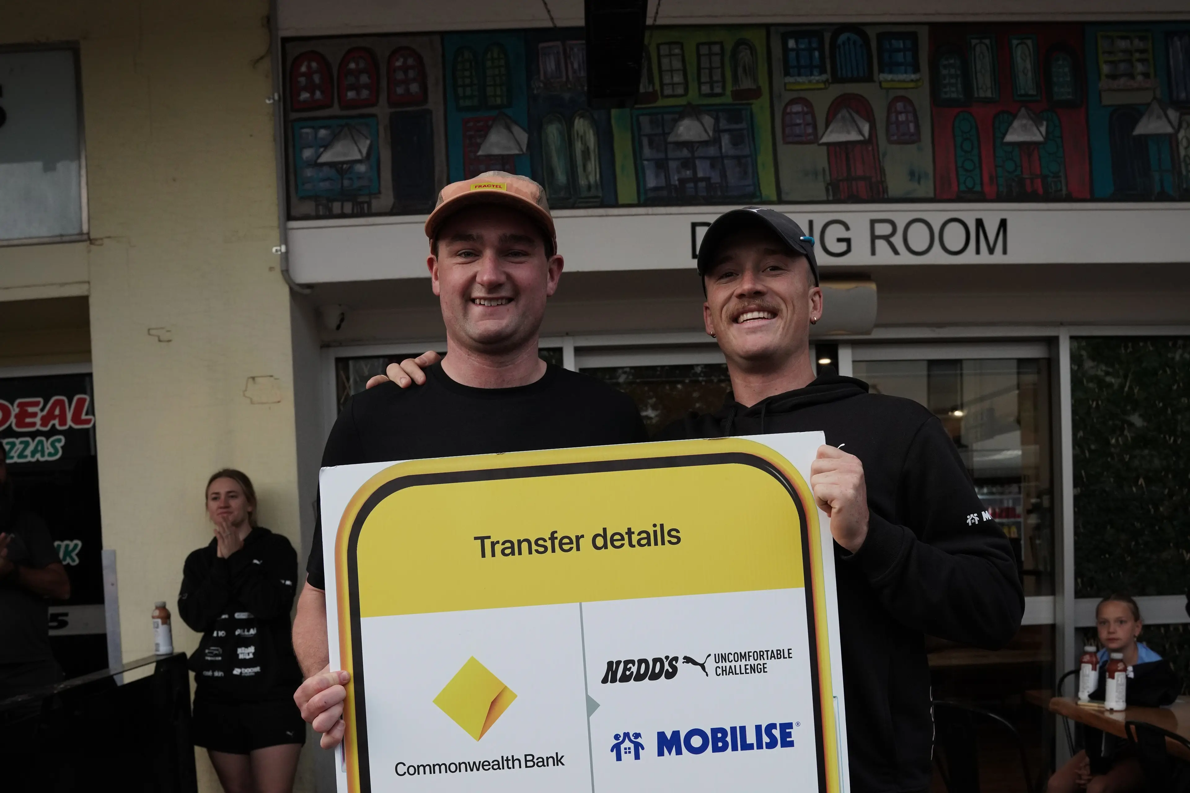 <p>Bill Ryan accepts a cheque from Nedd Brockmann towards Team Nuckleheads fundraising.</p>\\n