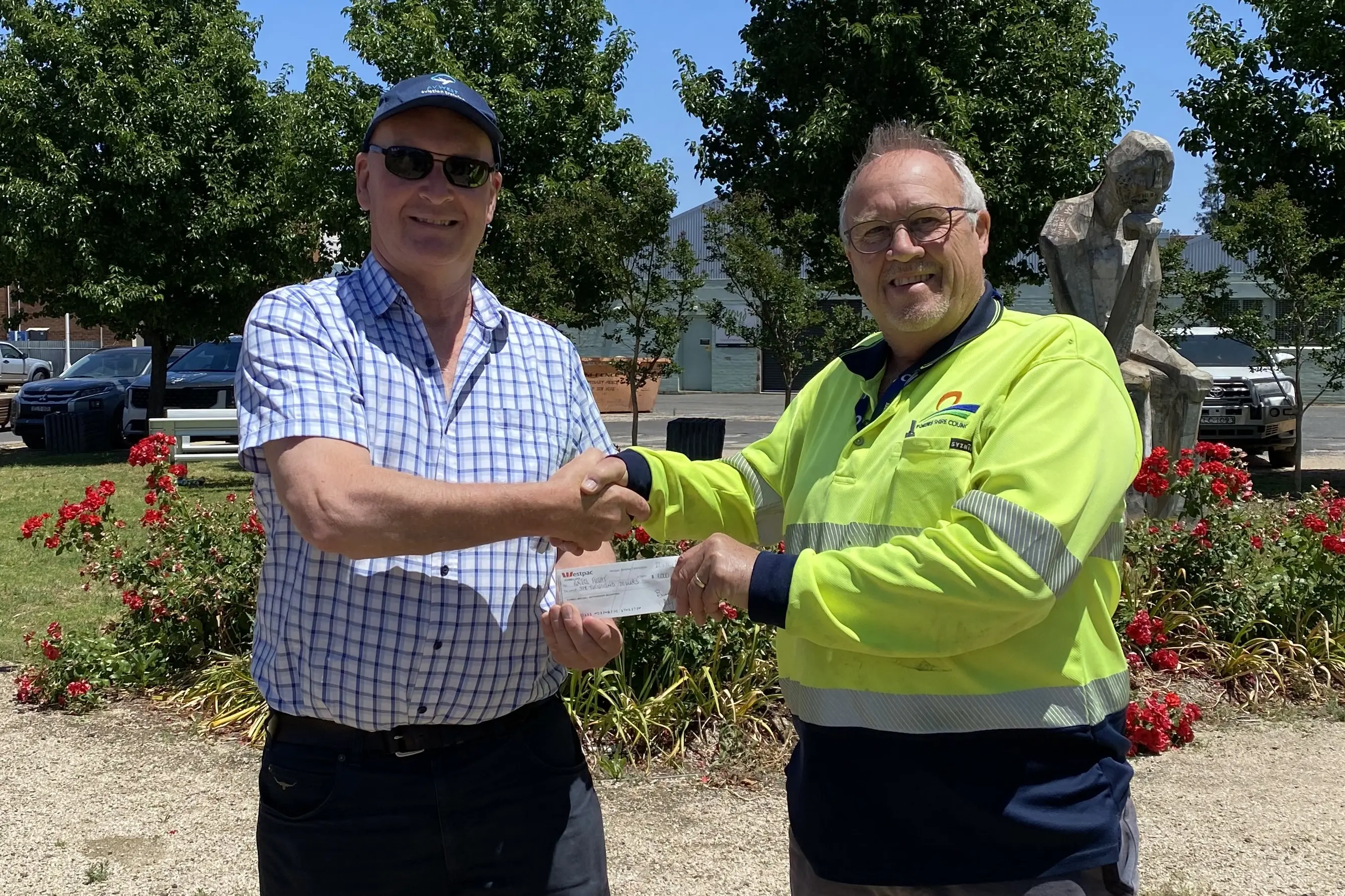 <p>Stuart Robb accepts a donation for Angel Flight from Forbes Motor Show\\'s David Stibbard. </p>\\n