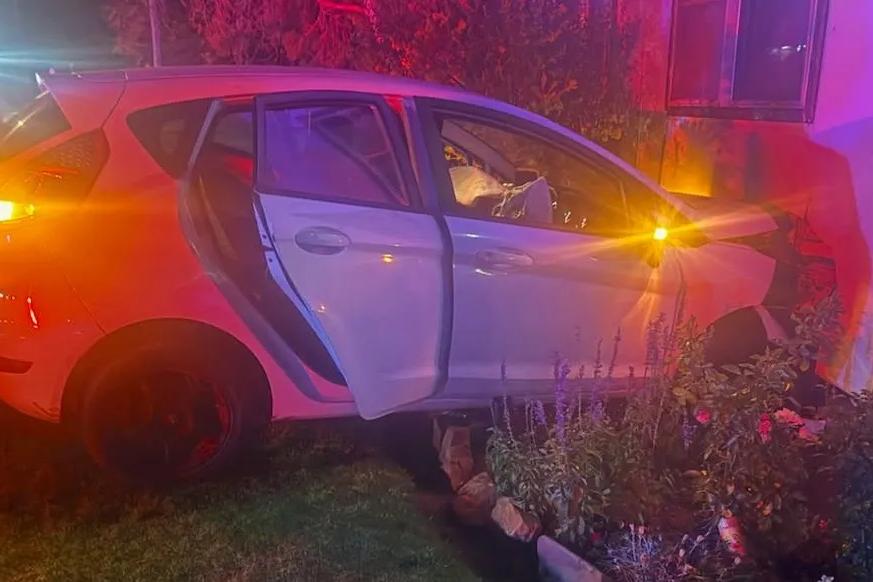 Police investigating after car crashes into home