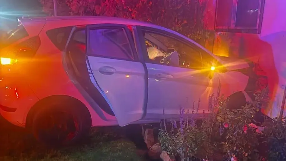 Police investigating after car crashes into home