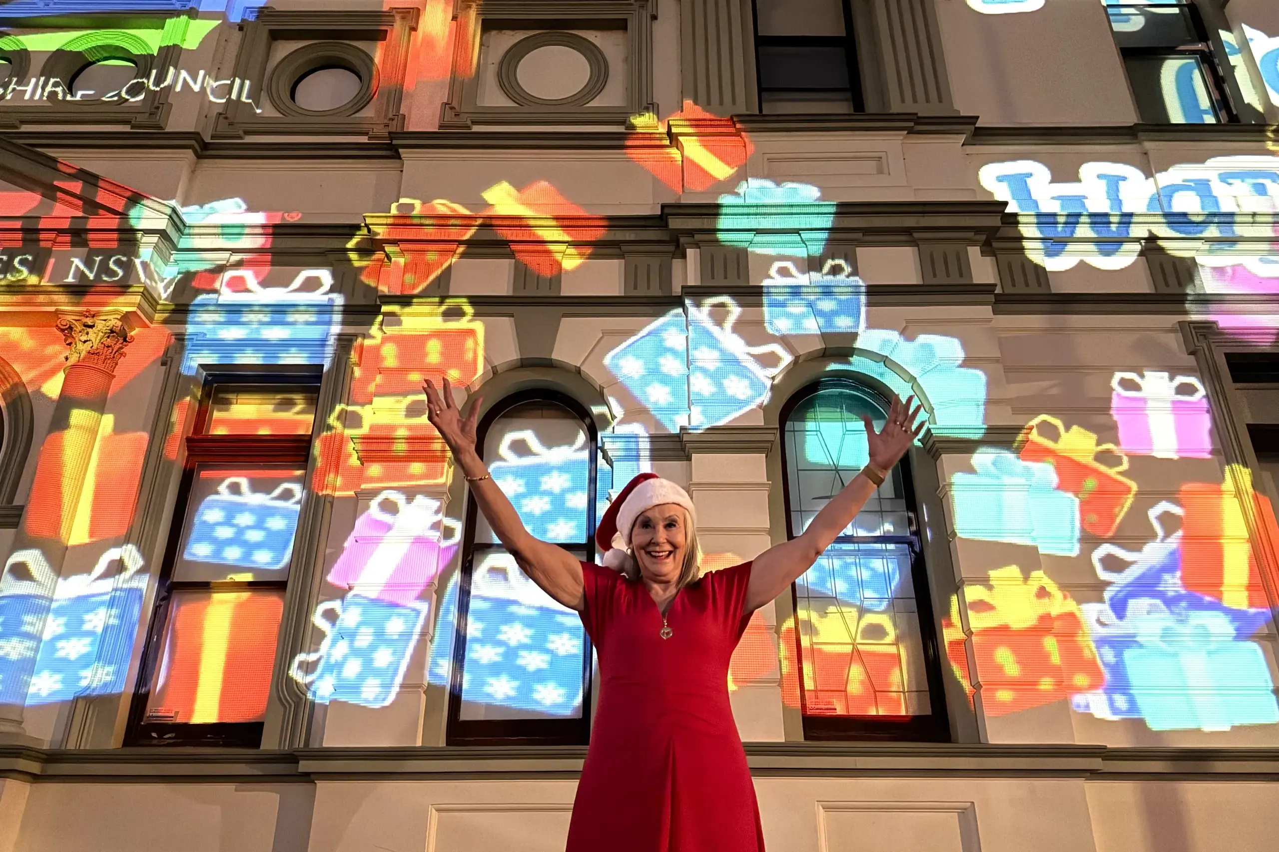 <p>Mayor Phyllis Miller celebrating the lighting of Town Hall for Christmas. PHOTO: Council</p>\\n