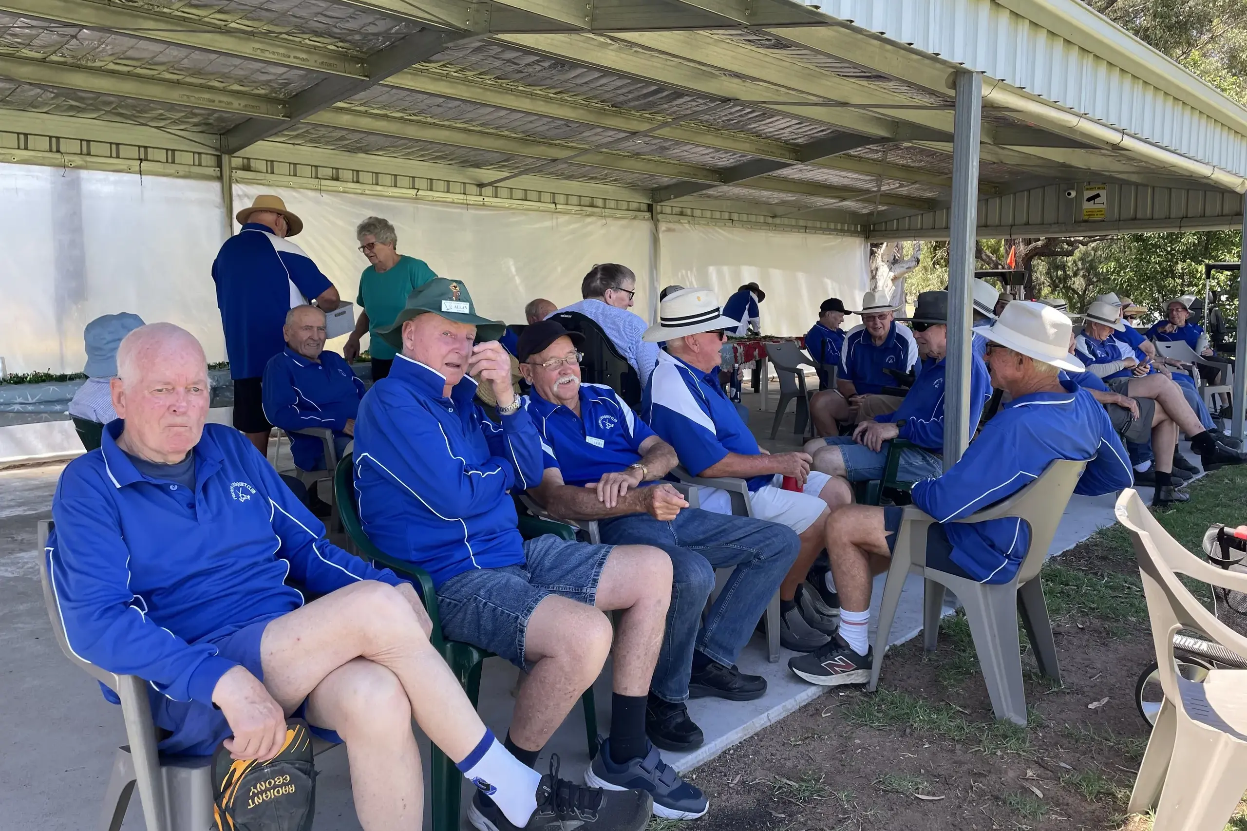 <p>Croquet club members socialising after their matches. </p>\\n