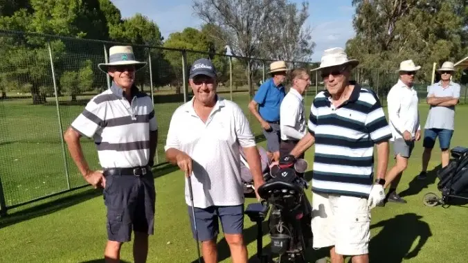 Golfers buffeted by winds