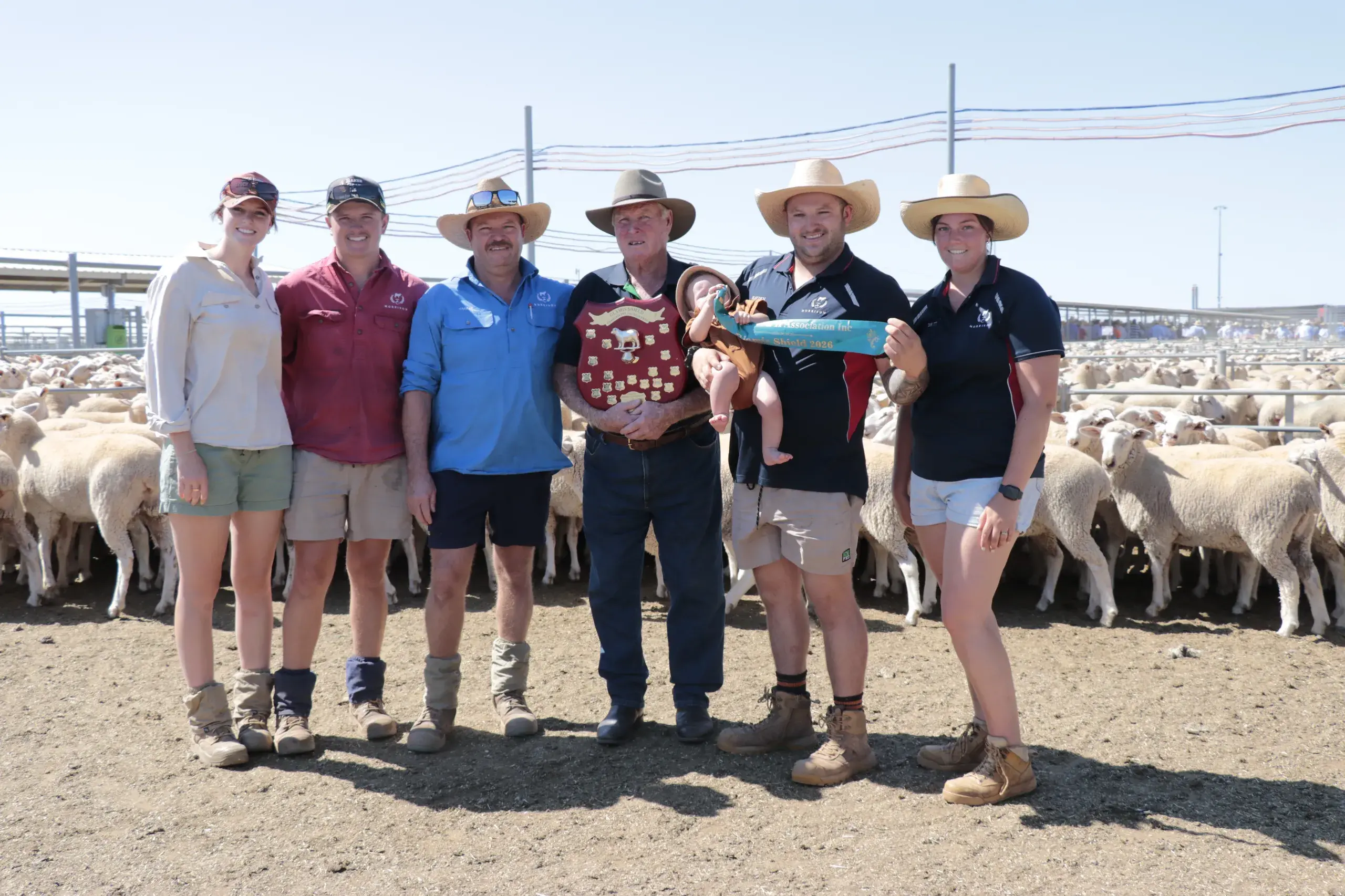 <p>Phoebe Wright, Jarrad Morrison, Trevor and Chris Morrison, Hayden, Albie and Britt Morrison with the Glamis Shield for the best-presented pen at Forbes\\' annual first cross ewe sale. PHOTOS: Renee Powell</p>\\n