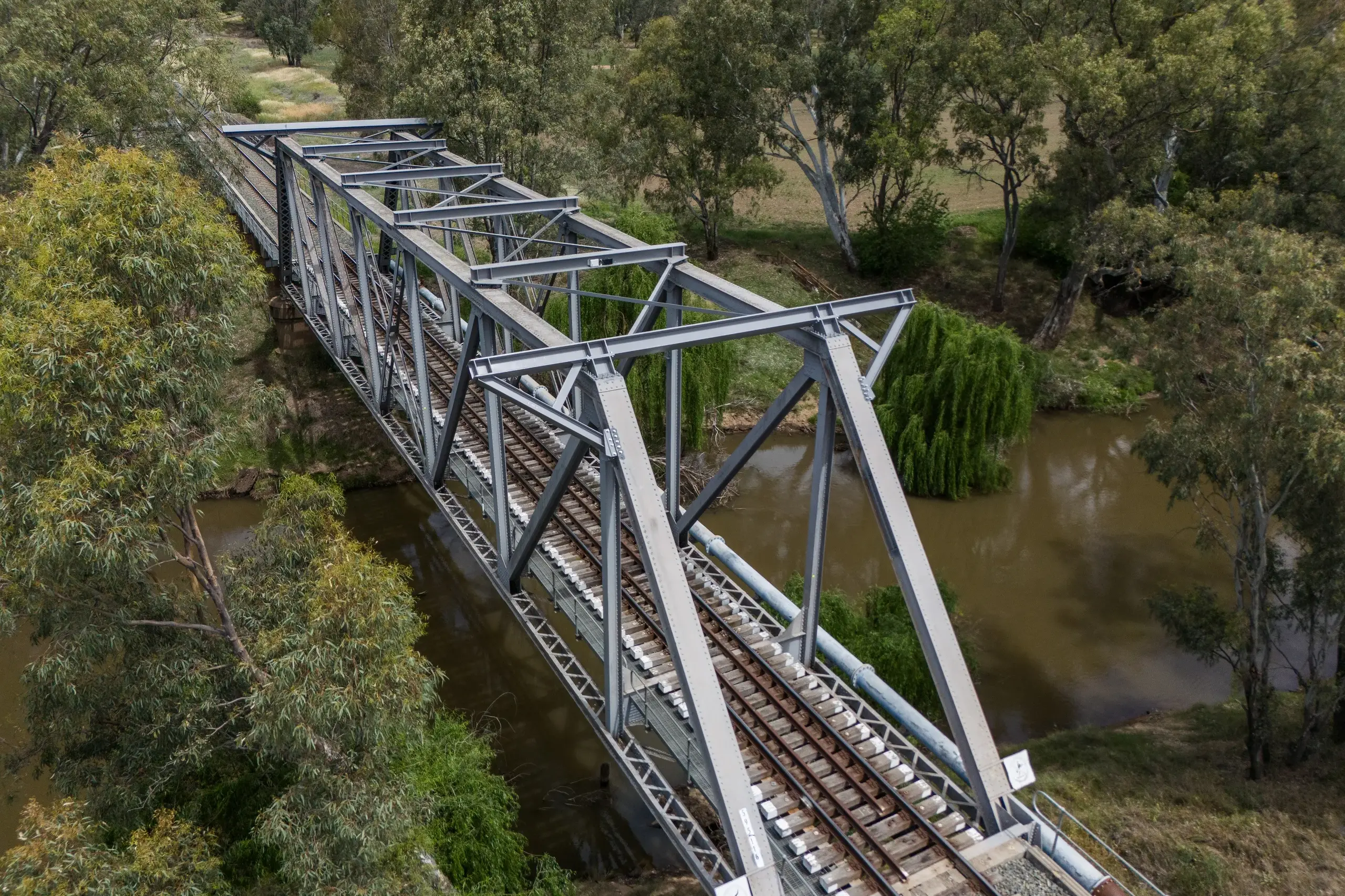 <p>The historic bridge over the Lachlan River on Bathurst Street was modified to allow clearance for double-stacked freight.</p>\\n