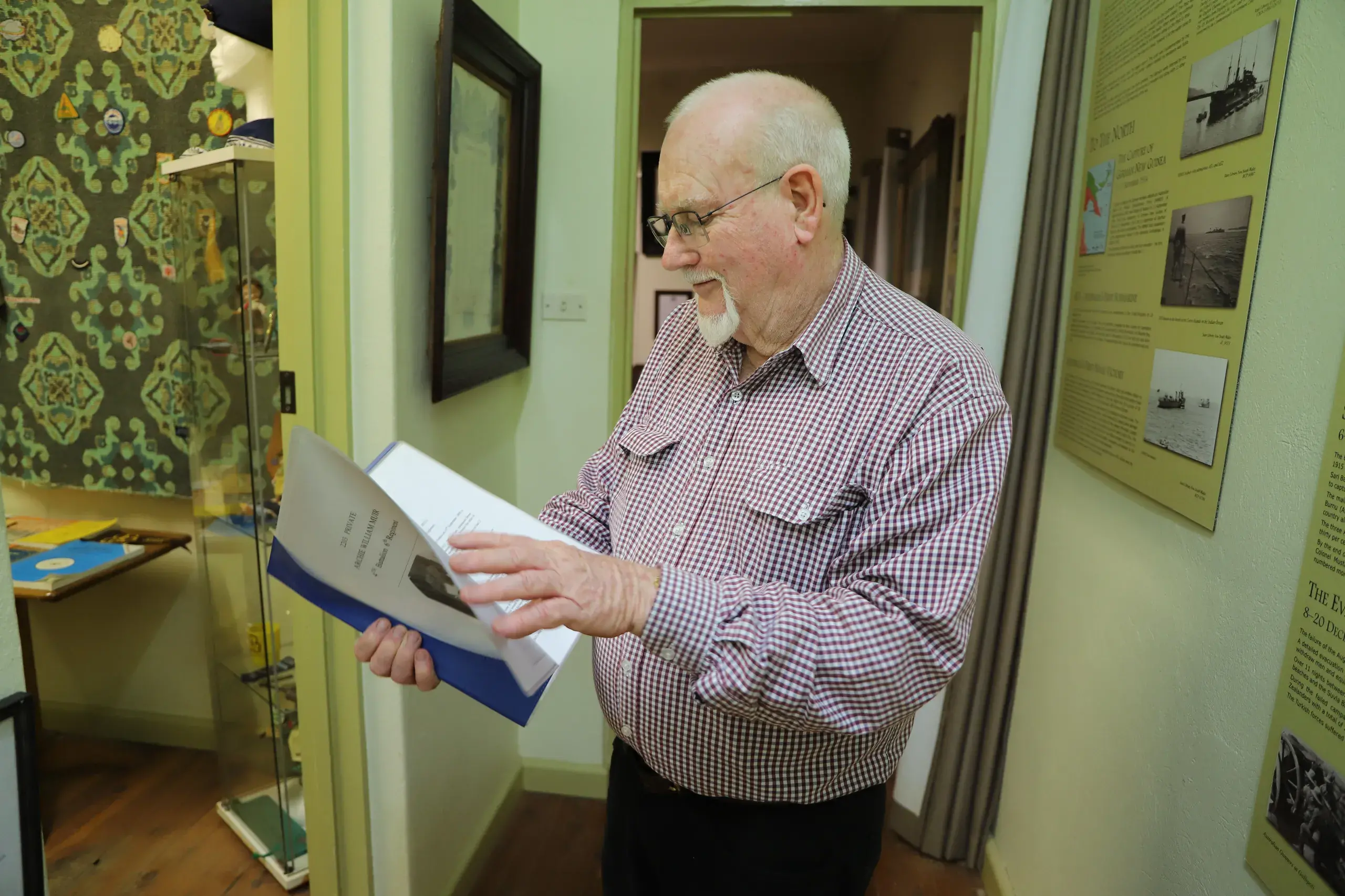 <p>Forbes Museum volunteer Graham Falconer looking through local service records in the museum collection. </p>\\n