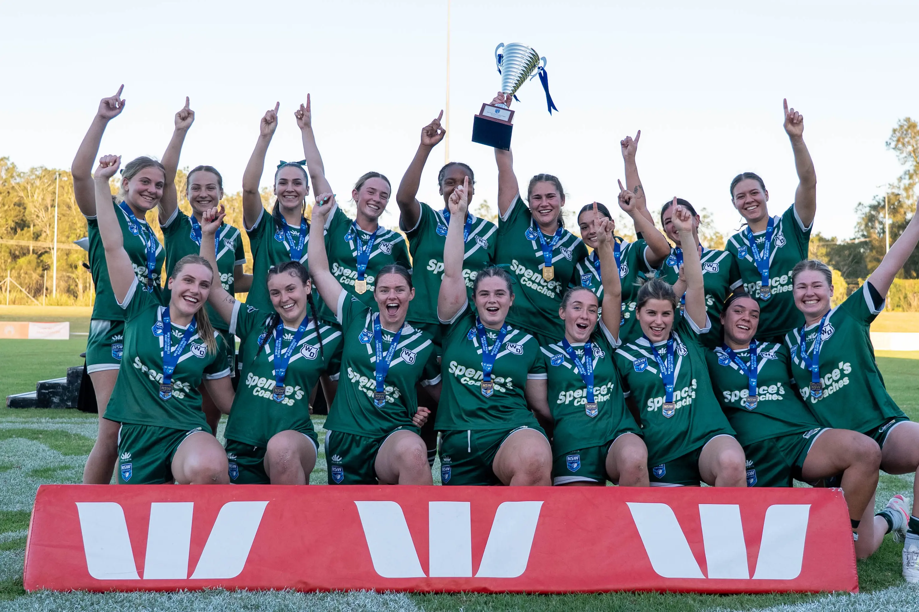 <p>The Western Rams claim an historic third Women\\u2019s Country Championships on Saturday afternoon, the side featuring Teagan Smede from Parkes (back, right) and Kirbie Mongan from Eugowra (front, third from right). PHOTOS: NSW Rugby League</p>\\n