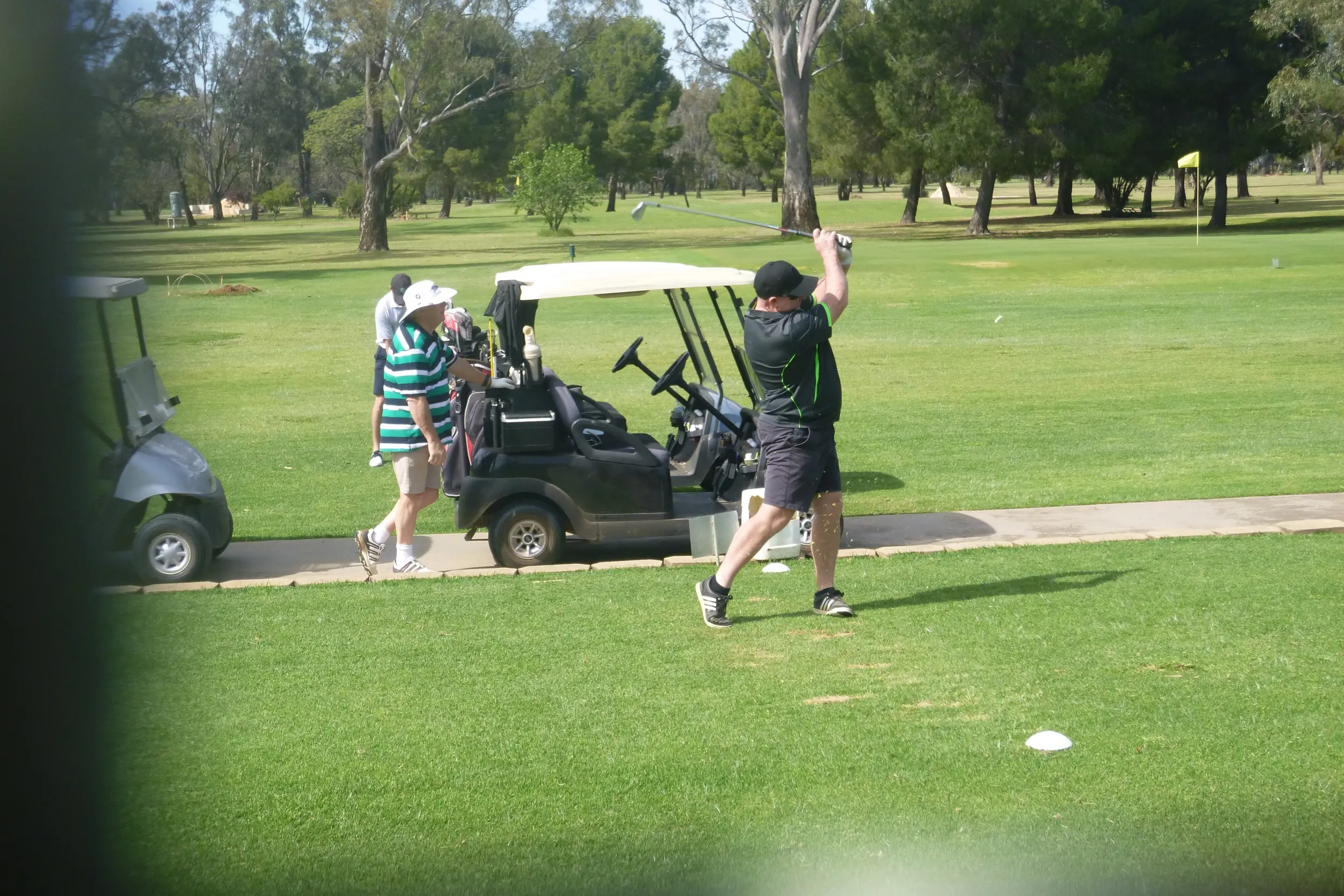 <p>Dave Mylecharane lets rip while Laurie O\\u2019Connor watches on. PHOTO: Short Putt</p>\\n