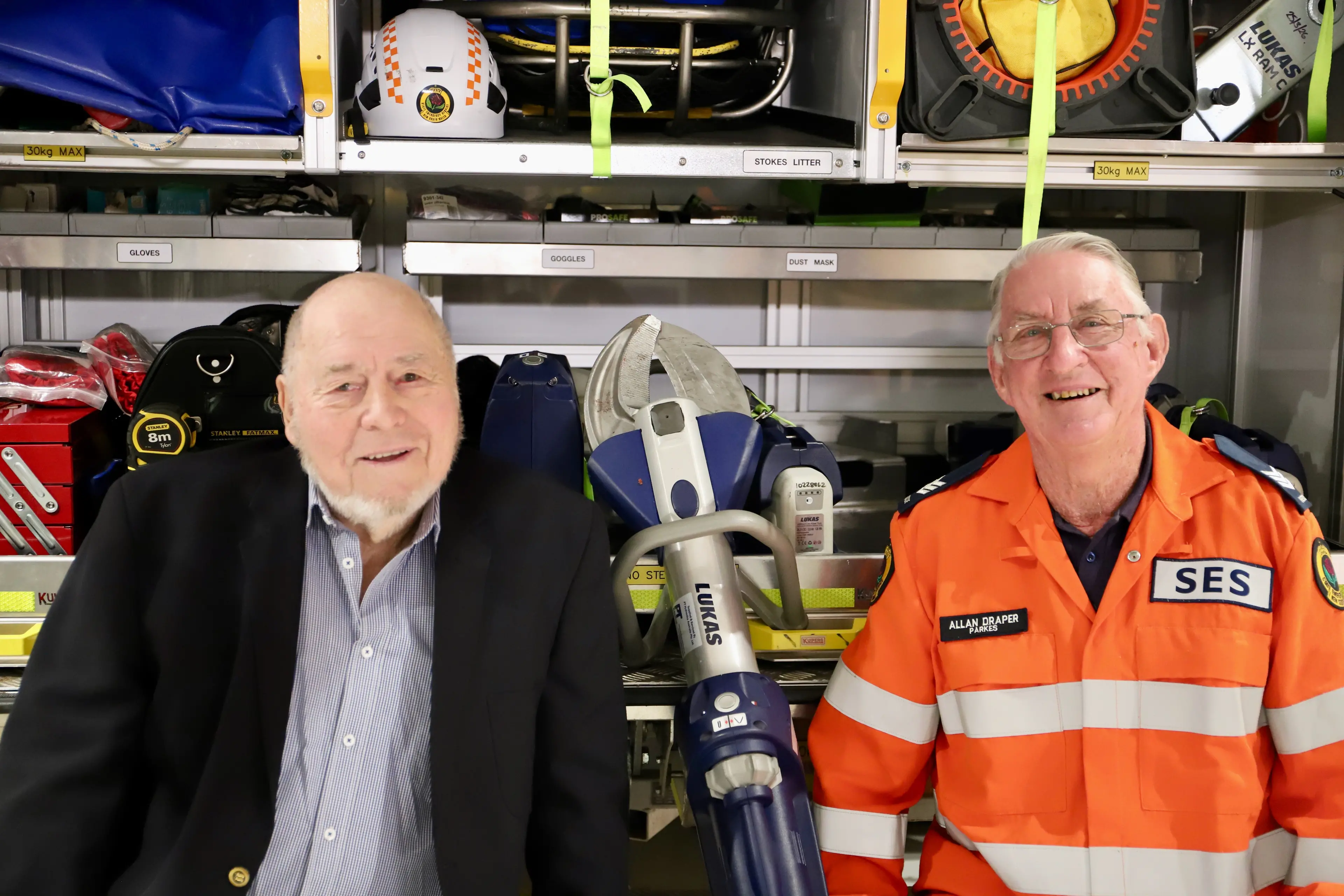 <p>Original Parkes Rescue Squad volunteer Neil Parker with Parkes SES Unit volunteer Allan Draper discuss the changes and innovations in equipment over their time during a tour of the new building.</p>\\n