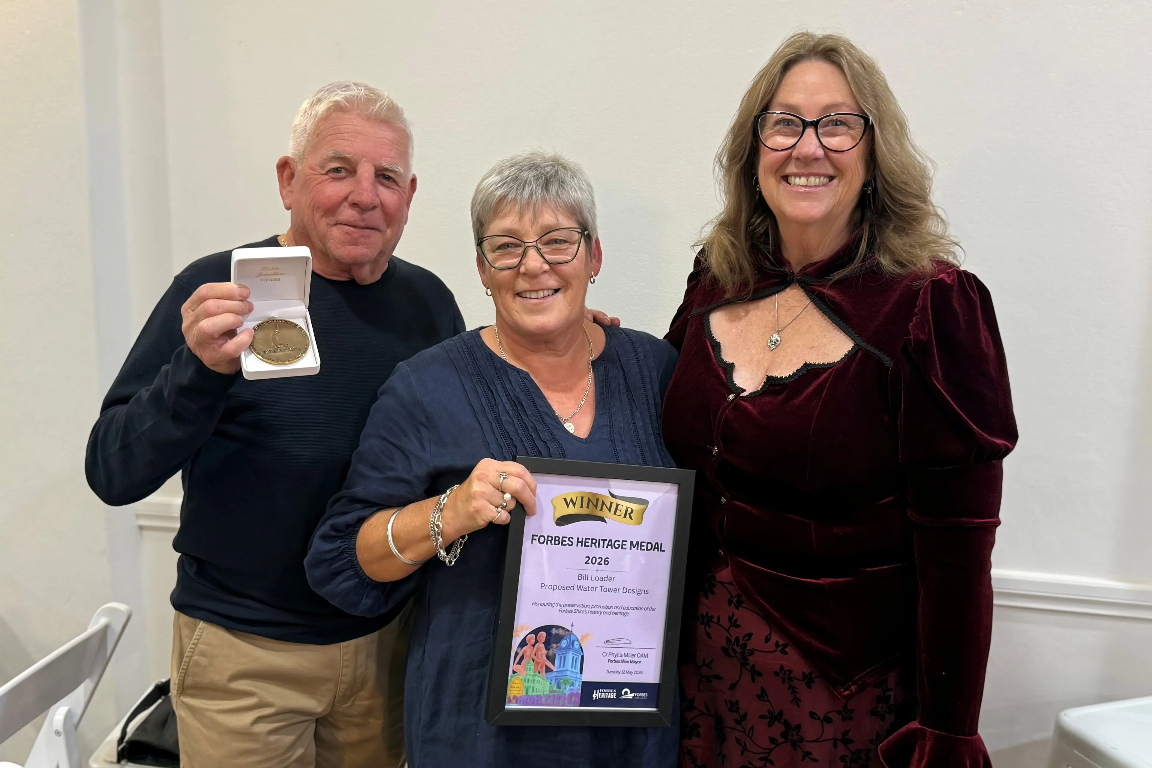 <p>Greg and Maureen Gunn accepted the Forbes Medal for the late Bill Loader\\'s contribution to heritage in Forbes from Cr Michele Herbert.</p>\\n