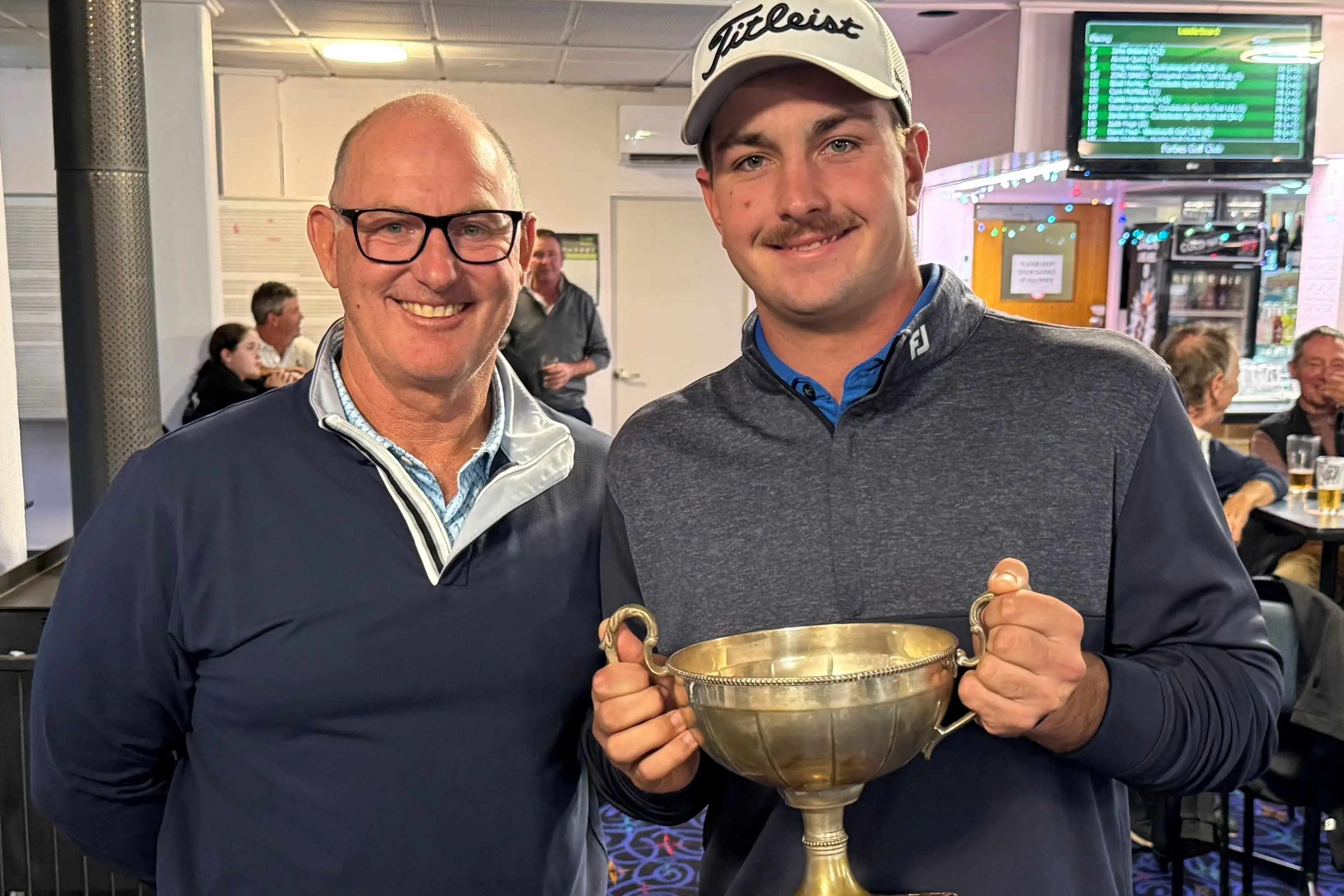 <p>Stuart French congratulates Forbes Open A Grade scratch winner Cooper Giddings.</p>\\n