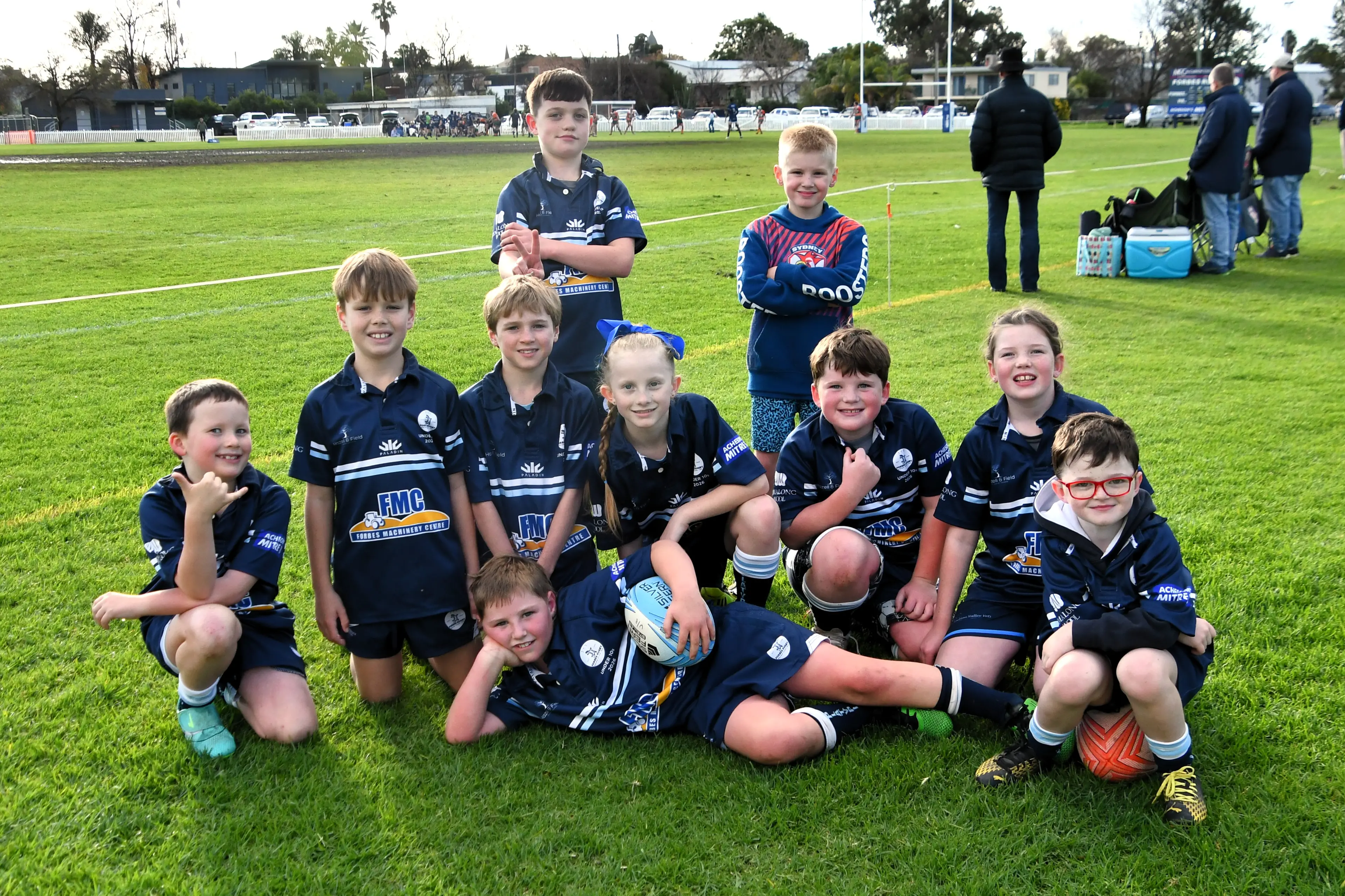 <p>Juniors Toby Wallace, Clyde Sheather, Will Hazell, Kit Beard, Willa Thornton, Jaxon Hoy, Finley Howden, Molly Howden and Freddy Howden (front) Mac Acheson cheering on the seniors on family day.</p>\\n