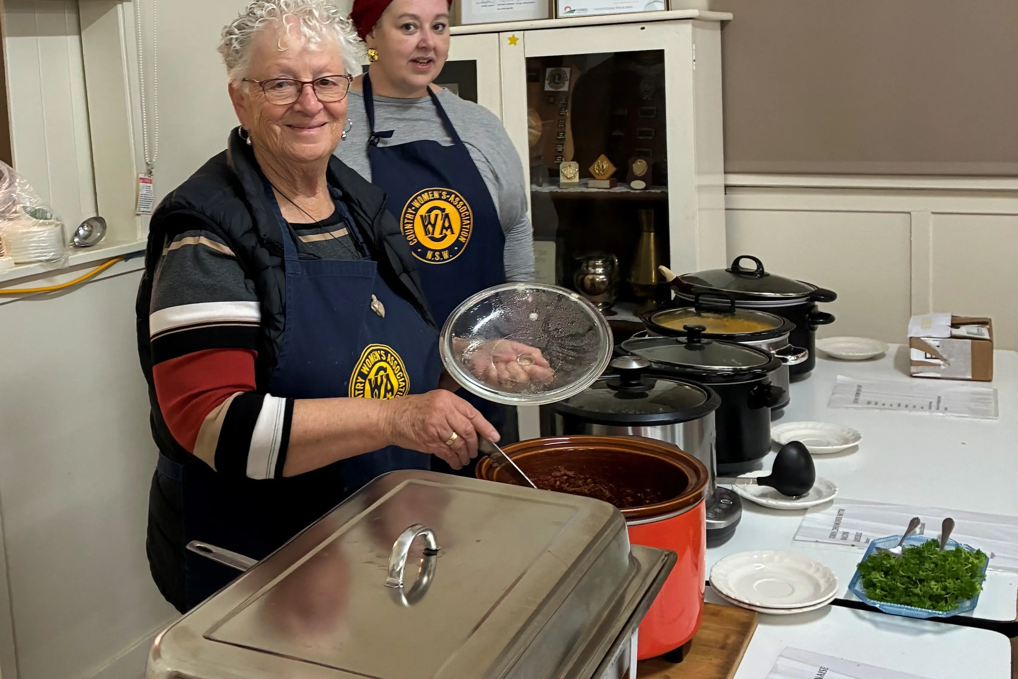 <p>Forbes Evening Branch CWA president Nic Little and Barb Goodger preparing soups for June soup and slice kitchen, raising funds to support local causes.</p>\\n