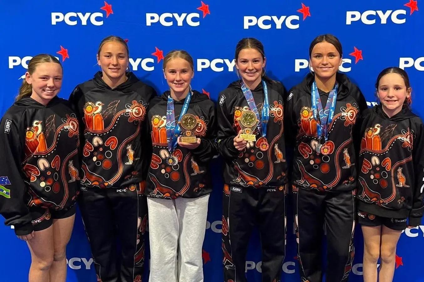 <p>Parkes PCYC gymnasts Annabelle Munday, Ruby Coote (Forbes), Lily Phillips, Rosie Hurford (Forbes), Stella Bull (Forbes) and Aubree Cowling collected two silver medals in the freestyle gymnastics and the speed run at the Nations of Origin tournament. PHOTO: Parkes PCYC</p>\\n
