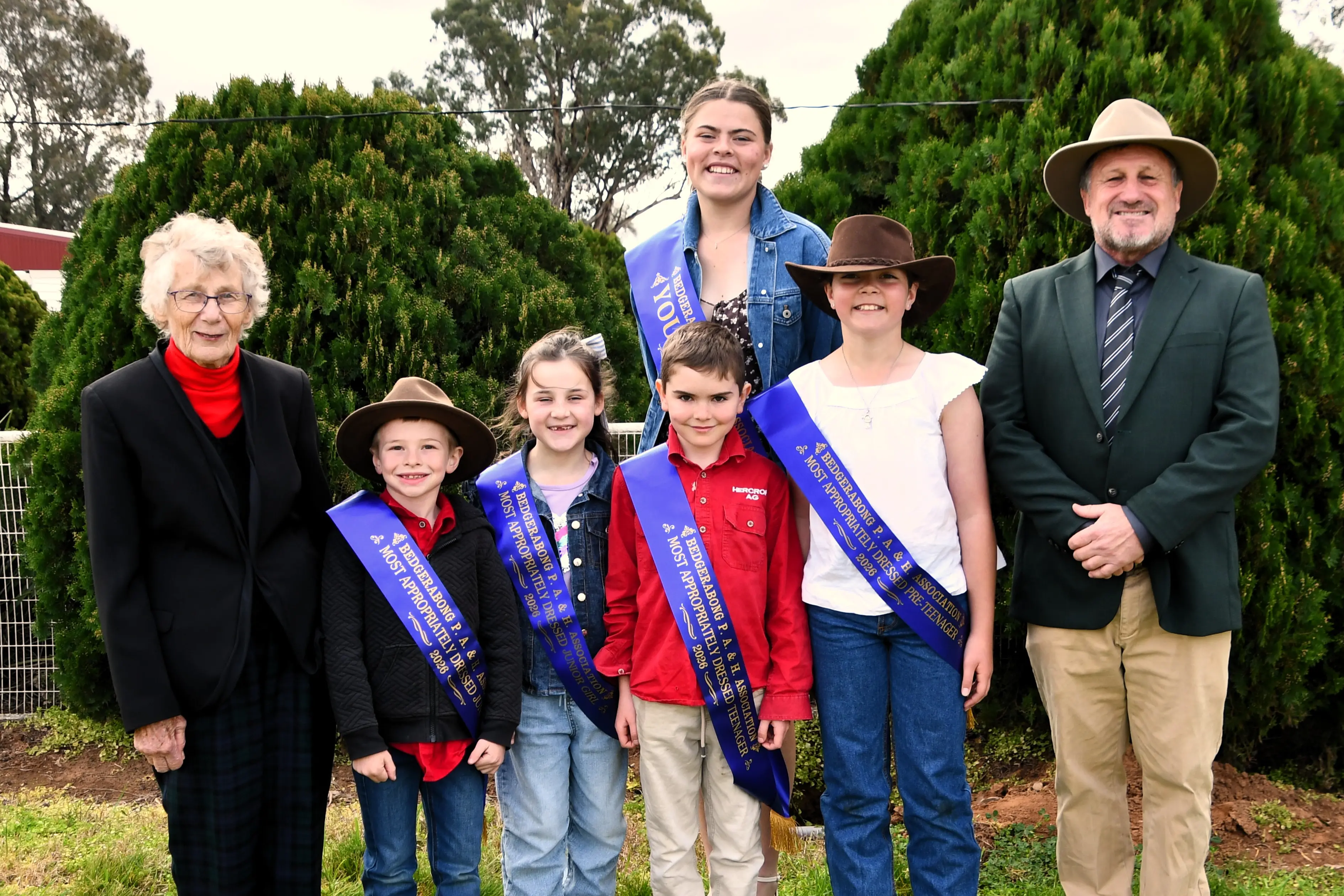 <p>Special guest Dot Noakes, Most Appropriately Dressed Junior Boy Carter Wall, Most Appropriately Dressed Junior Girl Sophie Brown, Most Appropriately Dressed Pre Teenage Boy Lloyd Herbert, 2026 Bedgerabong Young Woman Ebony Falconer, Most Appropriately Dressed Pre Teenage Girl Addi Morgan and Bedgerabong Show President Paul Faulkner.</p>\\n